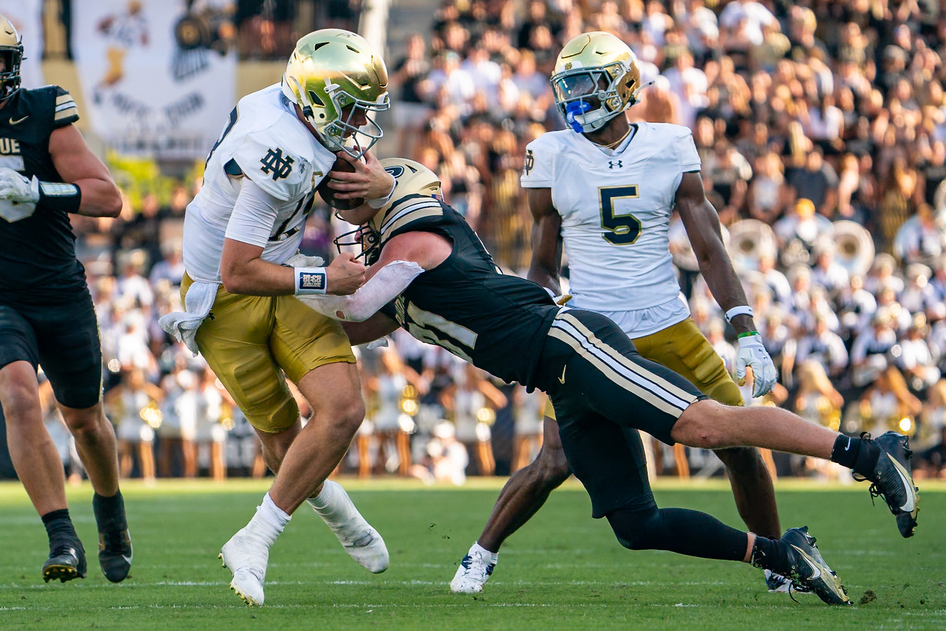 WEST LAFAYETTE, IN - SEPTEMBER 14, 2024: Notre Dame Senior QB Riley Leonard (13), Purdue So. Defensive Back Dillon Thieneman (31) during the Purdue University Boilermakers vs Notre Dame Fighting Irish Football game at Ross-Ade Stadium(Photo by Steve Bowen / Bowen Arrow Photography / Northern Indiana Sports Report)