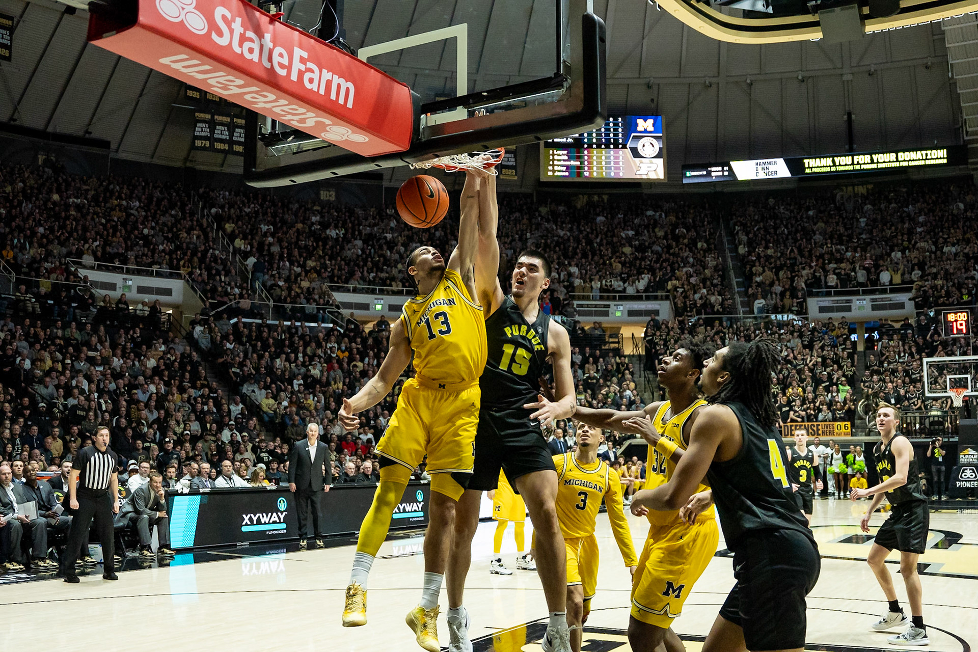 WEST LAFAYETTE, IN - JANUARY 23, 2024: Purdue Senior Center Zach Edey (15), Michigan Graduate Forward Olivier Nkamhoua (13) competing in Purdue versus Michigan Mens Basketball at Mackey Arena(Photo by Steve Bowen / Bowen Arrow Photography / Northern Indiana Sports Report)