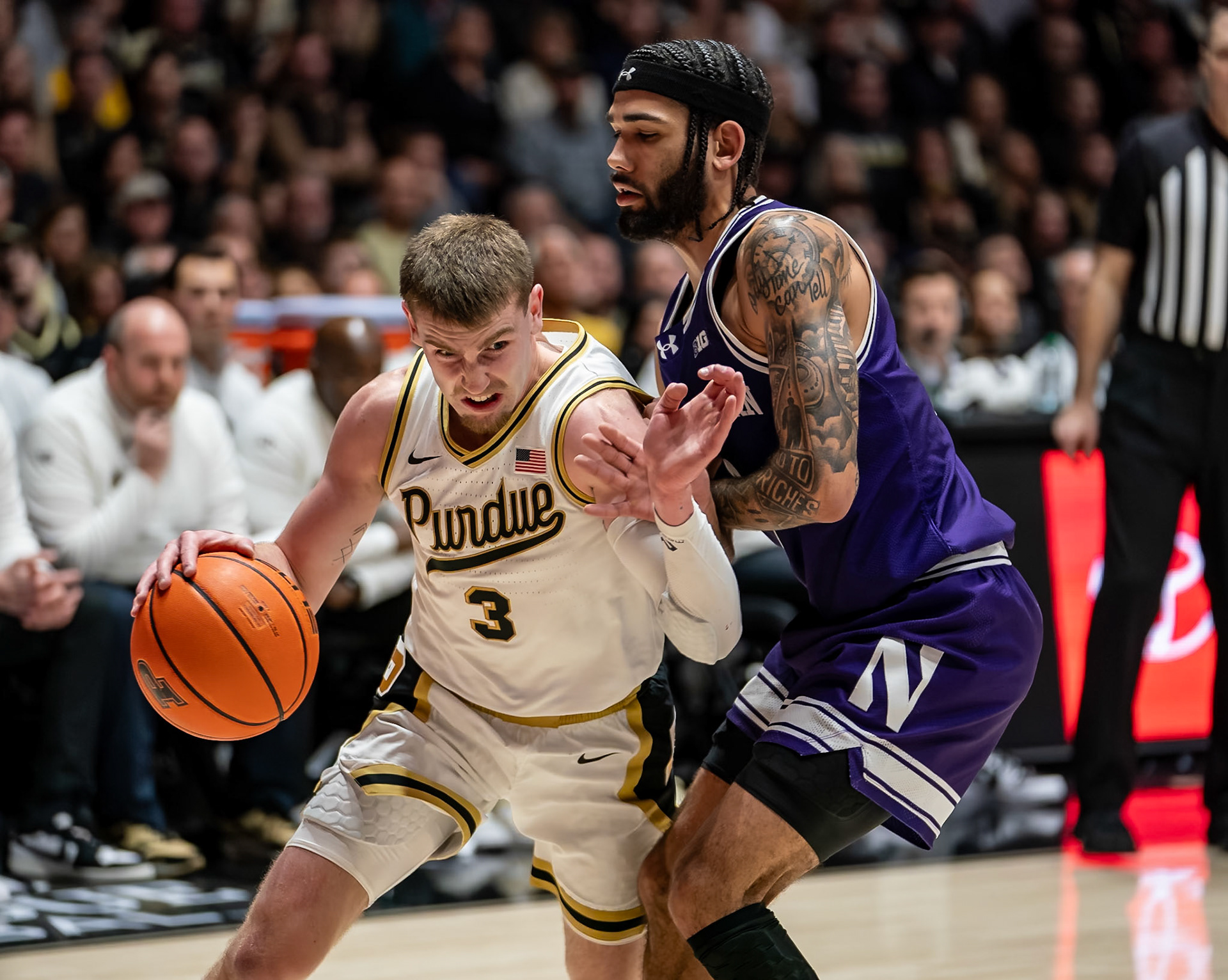 WEST LAFAYETTE, IN - JANUARY 31, 2024: Purdue Sophomore Guard Braden Smith (3), Northwestern Graduate Guard Boo Buie (0) competing in Purdue Boilermakers Mens Basketball versus the Northwestern Wildcats at Mackey Arena(Photo by Steve Bowen / Bowen Arrow Photography / Northern Indiana Sports Report)