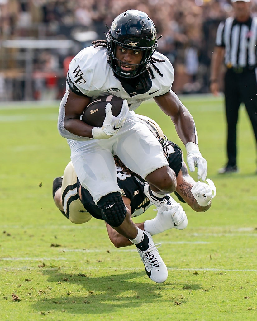 WEST LAFAYETTE, IN - SEPTEMBER 12, 2026: Wake Forest University Running Back Ty Clark III (4) slipping out of the hands of Purdue University Senior Defensive End Trey Smith (23) during the Purdue Boilermakers football game vs the Wake Forest Demon Deacons at Ross-Ade Stadium(Photo by Steve Bowen / Northern Indiana Sports Report)