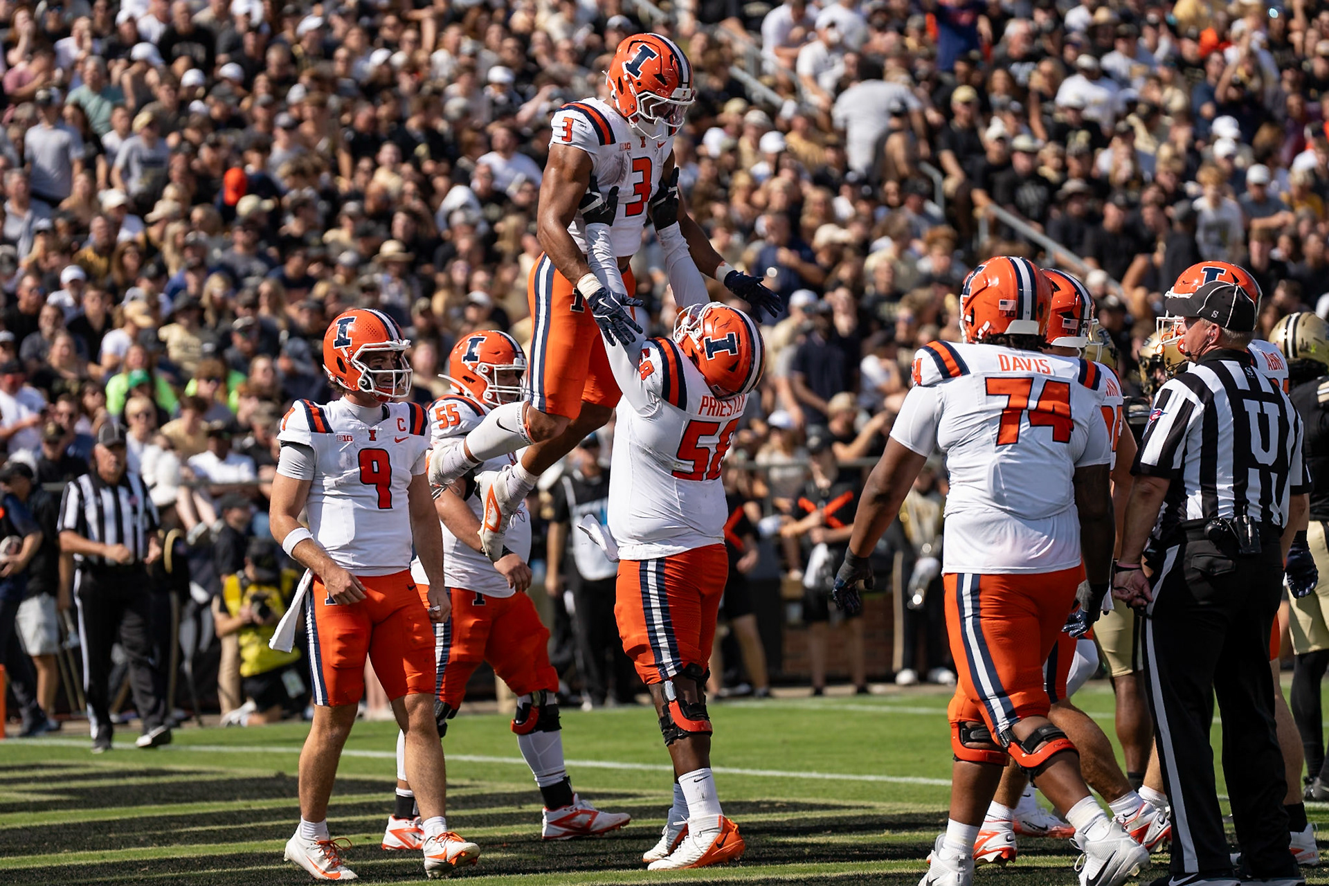 WEST LAFAYETTE, IN - OCTOBER 4, 2025: University of Illinois Junior RB Kaden Feagin (3) gets raised in the air by University of Illinois’ Senior OL Melvin Priestly (58) after scoring a touchdown during the Purdue Boilermaker Football vs University of Illinois Fighting Illini at Ross-Ade Stadium(Photo by Steve Bowen / Northern Indiana Sports Report)