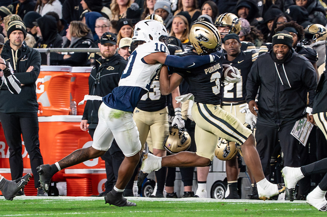 WEST LAFAYETTE, IN - NOVEMBER 16, 2024: Penn State University Freshman Safety Dejuan Lane (10) goes high across the facemask to try and bring down Purdue University Freshman Running Back Jaheim Merriweather (3), in Purdue University Boilermakers vs Penn State University Nittany Lions Football game at Ross-Ade Stadium(Photo by Steve Bowen / Bowen Arrow Photography / Northern Indiana Sports Report)