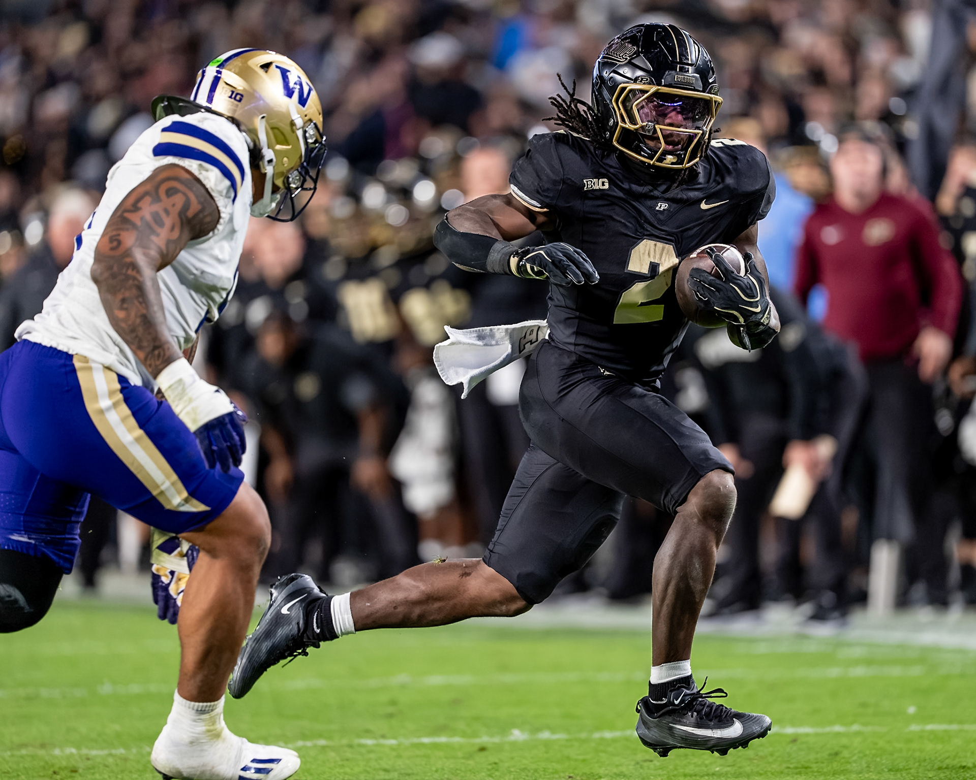 WEST LAFAYETTE, IN - OCTOBER 16, 2026: Purdue University Sophomore Running Back Fame Ijeboi (2), University of Washington CB Ramonz Adams Jr. (8) during the Purdue Boilermakers vs Washington Huskies football game at Ross-Ade Stadium(Photo by Steve Bowen / Northern Indiana Sports Report)