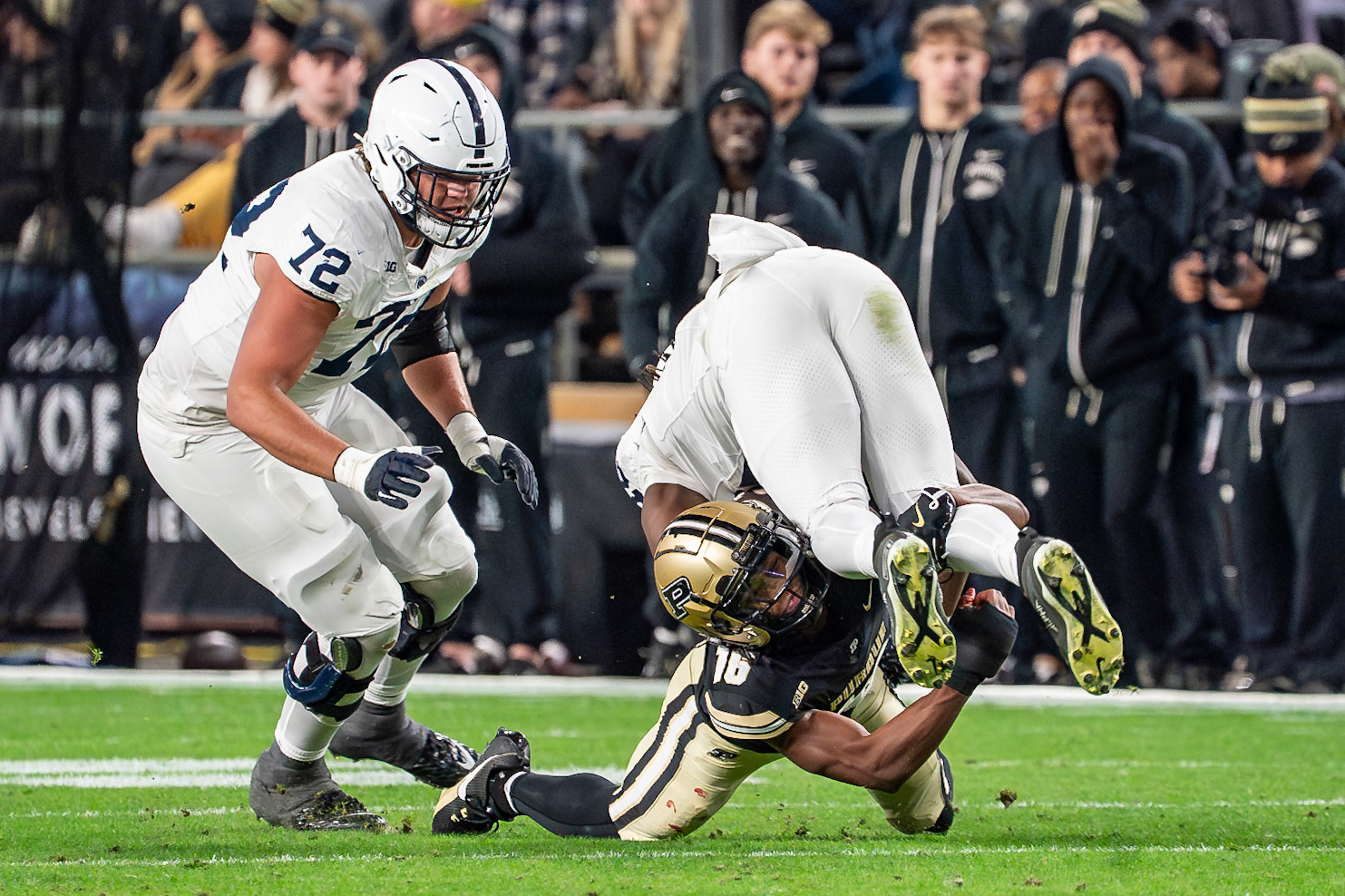 WEST LAFAYETTE, IN - NOVEMBER 16, 2024: Penn State University Tight End Khalil Dinkins (16) gets upended by Purdue University's Freshman Defensive Back Hudauri Hines (16) in Purdue University Boilermakers vs Penn State University Nittany Lions Football game at Ross-Ade Stadium(Photo by Steve Bowen / Bowen Arrow Photography / Northern Indiana Sports Report)
