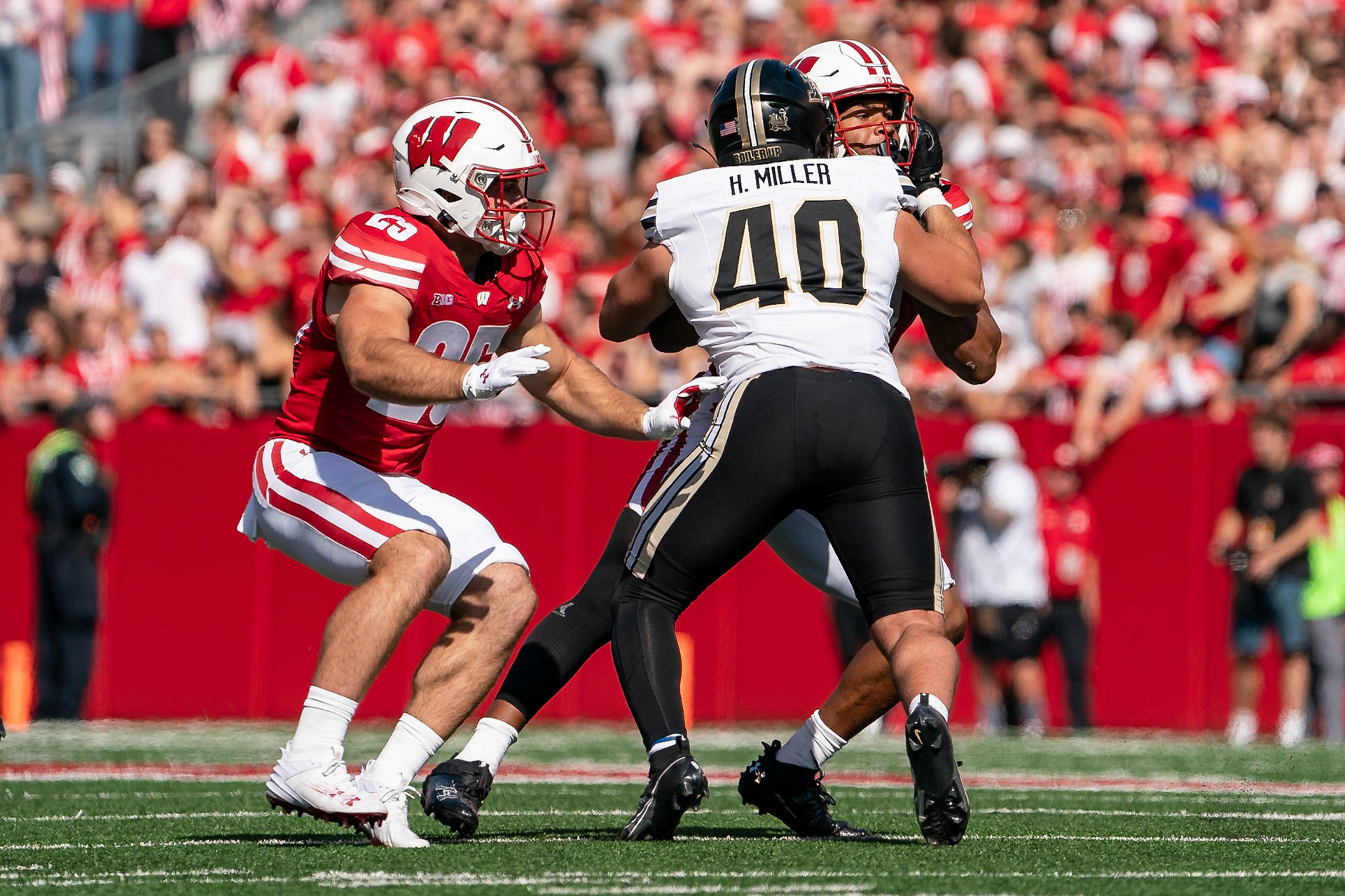 MADISON, WI - OCTOBER 5, 2024: Purdue University Sophomore Linebacker Hudson Miller (40) blocking University of Wisconsin Redshirt Sophomore WR Chris Brooks Jr. (84) while University of Wisconsin Redshirt Sophomore RB Cade Yacamelli (25) looks to make a play during the Purdue University Boilermakers at University of Wisconsin Badger Football game at Camp Randall Stadium(Photo by Steve Bowen / NISports Report)