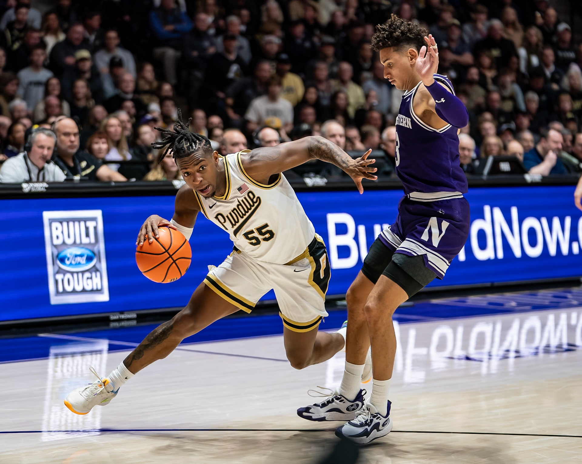 WEST LAFAYETTE, IN - JANUARY 31, 2024: Purdue 5th year Guard Lance Jones (55), Northwestern Senior Guard Ty Berry (3) competing in Purdue Boilermakers Mens Basketball versus the Northwestern Wildcats at Mackey Arena(Photo by Steve Bowen / Bowen Arrow Photography / Northern Indiana Sports Report)