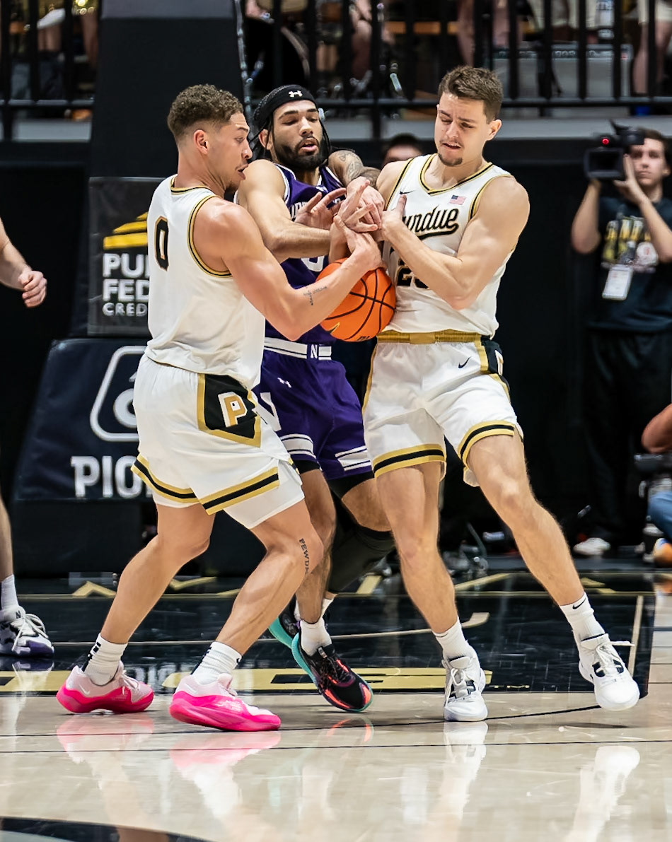 WEST LAFAYETTE, IN - JANUARY 31, 2024: Northwestern Graduate Guard Boo Buie (0), Purdue Senior Forward Mason Gillis (0), Purdue Redshirt Freshman Forward Camden Heide (23) competing in Purdue Boilermakers Mens Basketball versus the Northwestern Wildcats at Mackey Arena(Photo by Steve Bowen / Bowen Arrow Photography / Northern Indiana Sports Report)