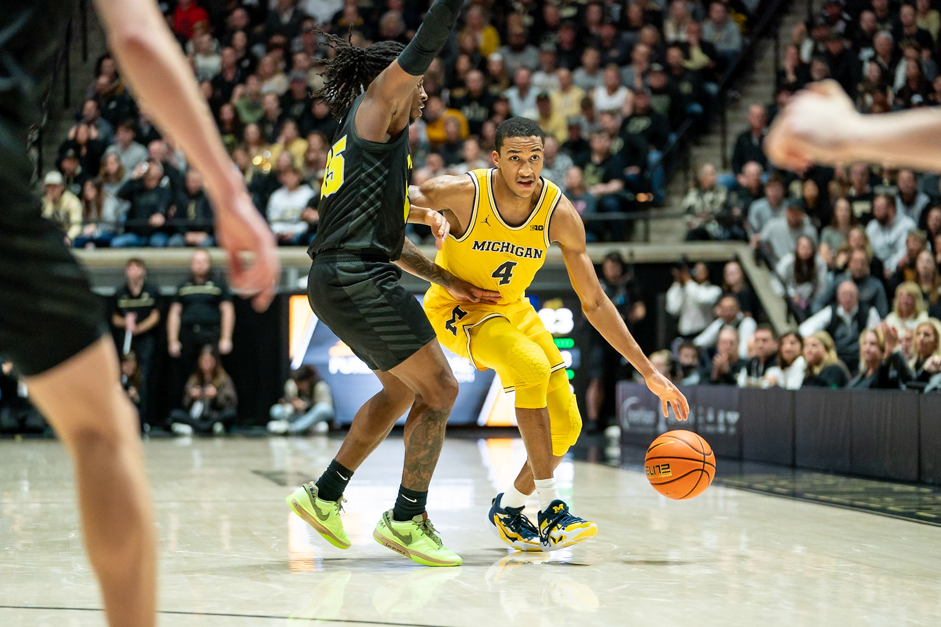 WEST LAFAYETTE, IN - JANUARY 23, 2024: Michigan Graduate Guard Nimari Burnett (4), Purdue 5th year Guard Lance Jones (55) competing in Purdue versus Michigan Mens Basketball at Mackey Arena(Photo by Steve Bowen / Bowen Arrow Photography / Northern Indiana Sports Report)