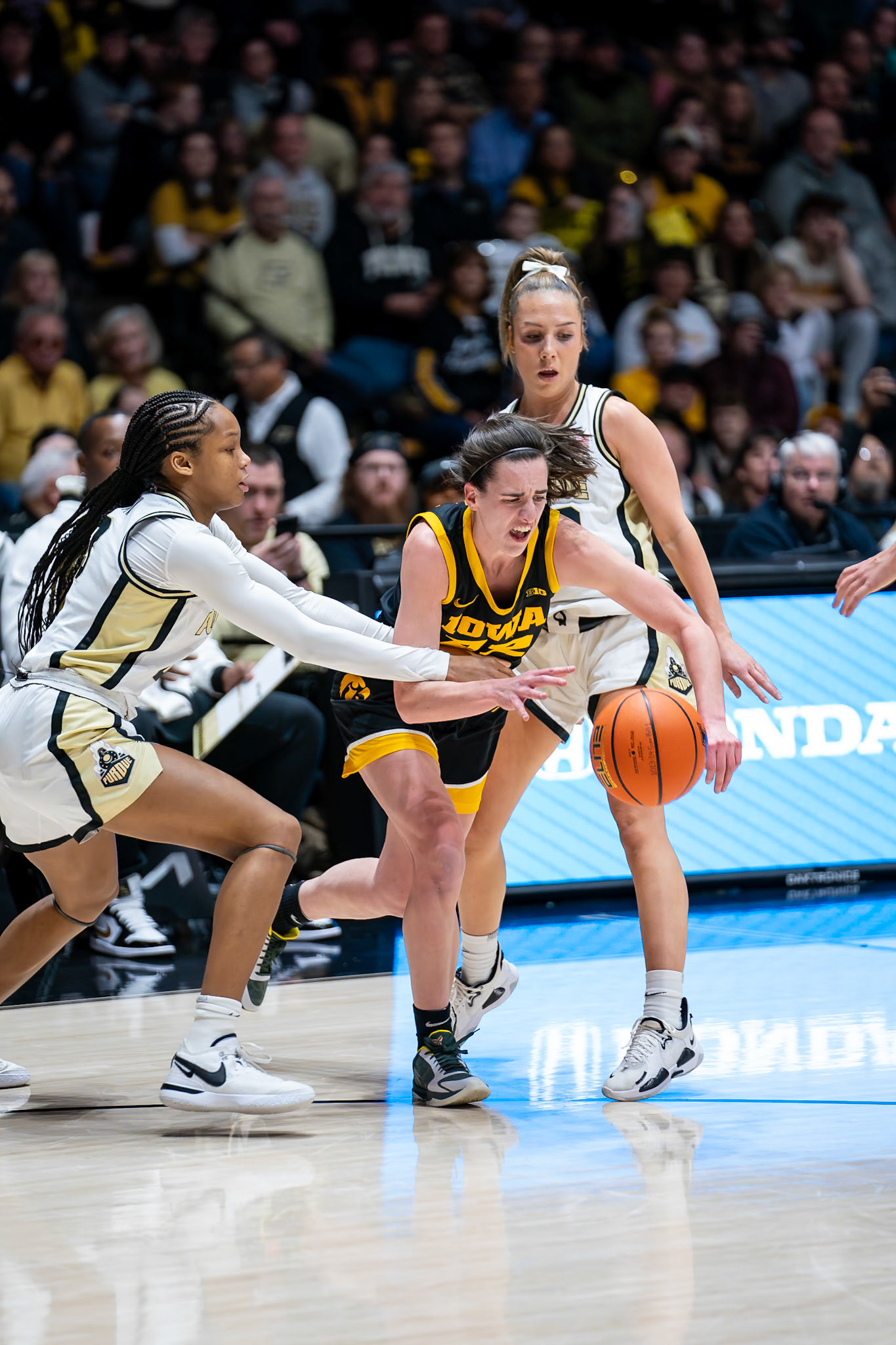 WEST LAFAYETTE, IN - JANUARY 10, 2024: Iowa Guard Senior Caitlin Clark (22), Purdue Junior Guard Jayla Smith (3), Purdue 5th Year Guard Abbey Ellis (23) competing in Purdue Boilermaker Women's Basketball vs the Iowa Hawkeyes at Mackey Arena(Photo by Steve Bowen / Bowen Arrow Photography / Northern Indiana Sports Report)