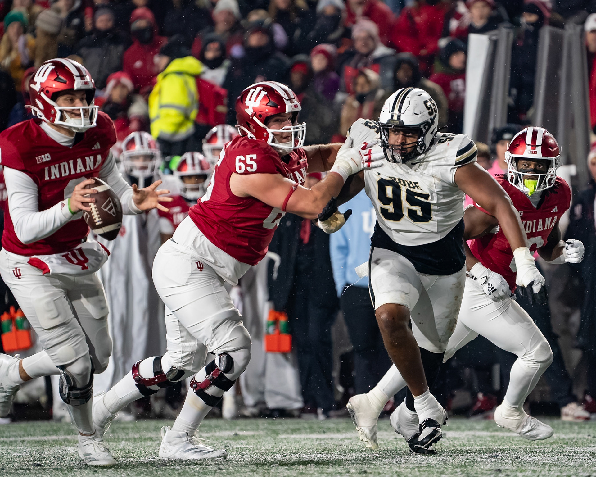 BLOOMINGTON, IN - NOVEMBER 30, 2024: Purdue University Senior Defensive Lineman Joe Anderson (95), Indiana University Redshirt Sophomore OL Carter Smith (65) during the Purdue University Boilermakers at Indiana University Hoosiers Football game at Memorial Stadium(Photo by Steve Bowen / Bowen Arrow Photography / Northern Indiana Sports Report)