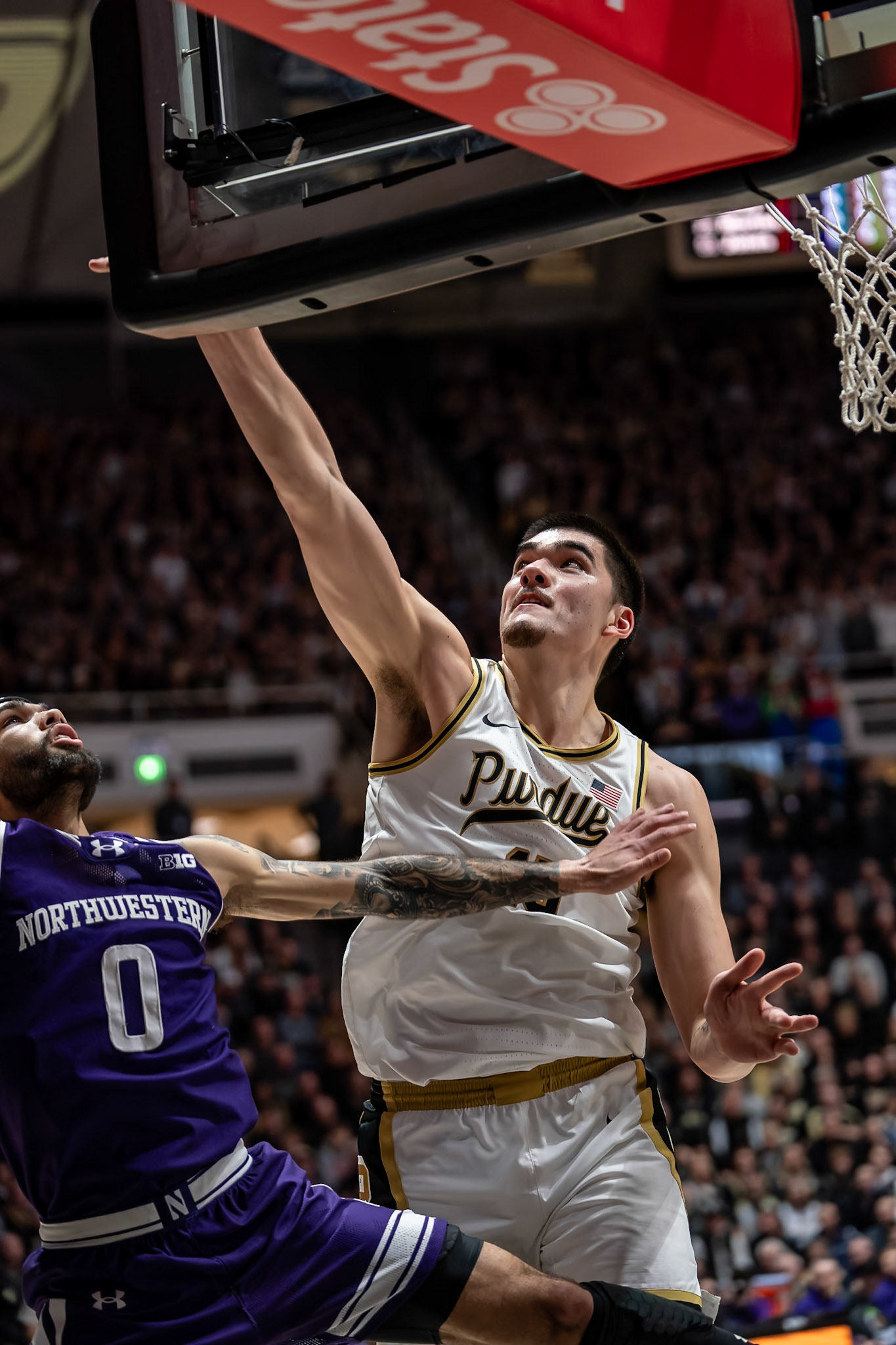 WEST LAFAYETTE, IN - JANUARY 31, 2024: Northwestern Graduate Guard Boo Buie (0), Purdue Senior Center Zach Edey (15) competing in Purdue Boilermakers Mens Basketball versus the Northwestern Wildcats at Mackey Arena(Photo by Steve Bowen / Bowen Arrow Photography / Northern Indiana Sports Report)