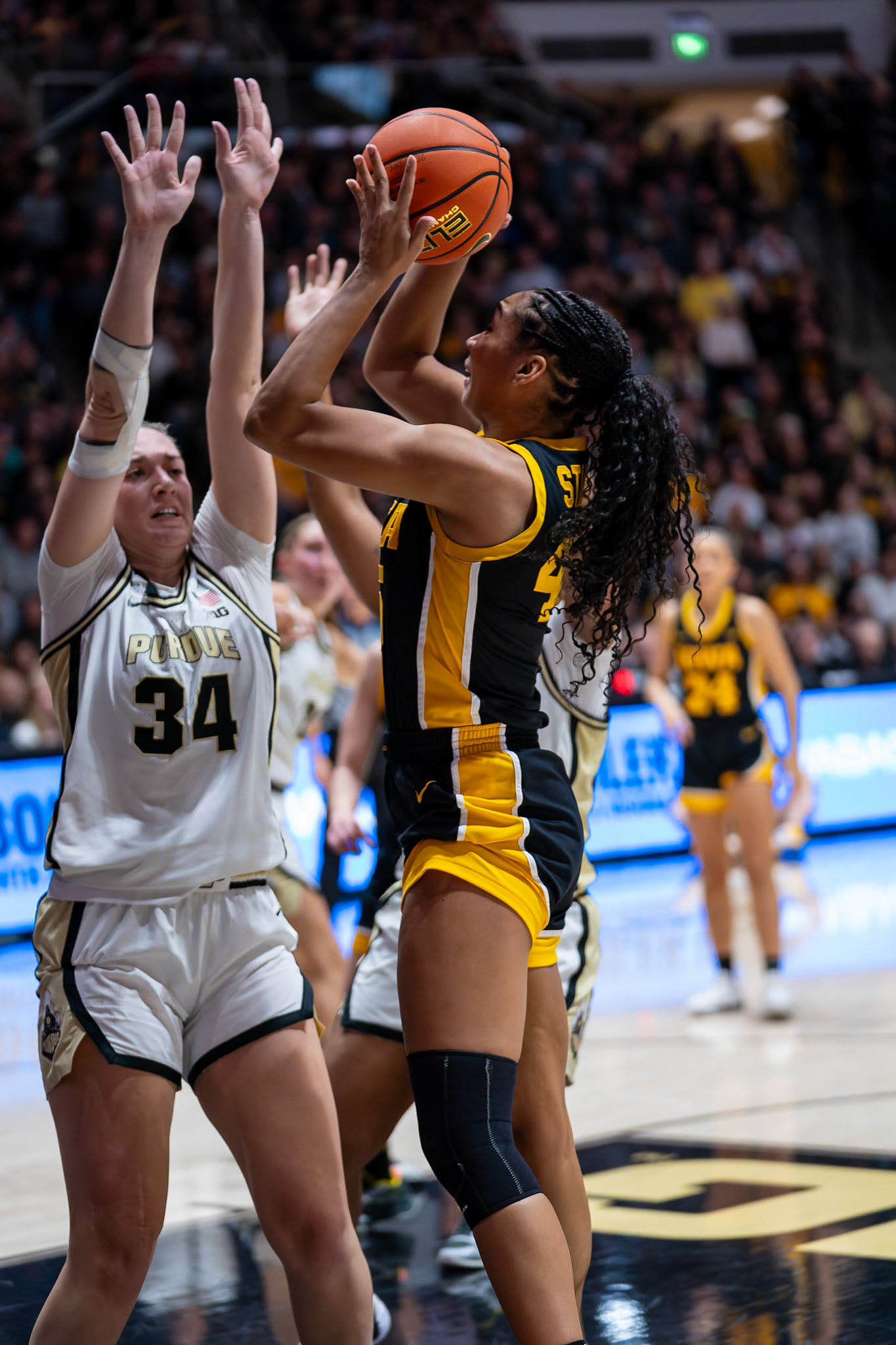 WEST LAFAYETTE, IN - JANUARY 10, 2024: Purdue 6th Year Forward Caitlyn Harper (34), Iowa Forward Sophomore Hannah Stuelke (45) competing in Purdue Boilermaker Women's Basketball vs the Iowa Hawkeyes at Mackey Arena(Photo by Steve Bowen / Bowen Arrow Photography / Northern Indiana Sports Report)