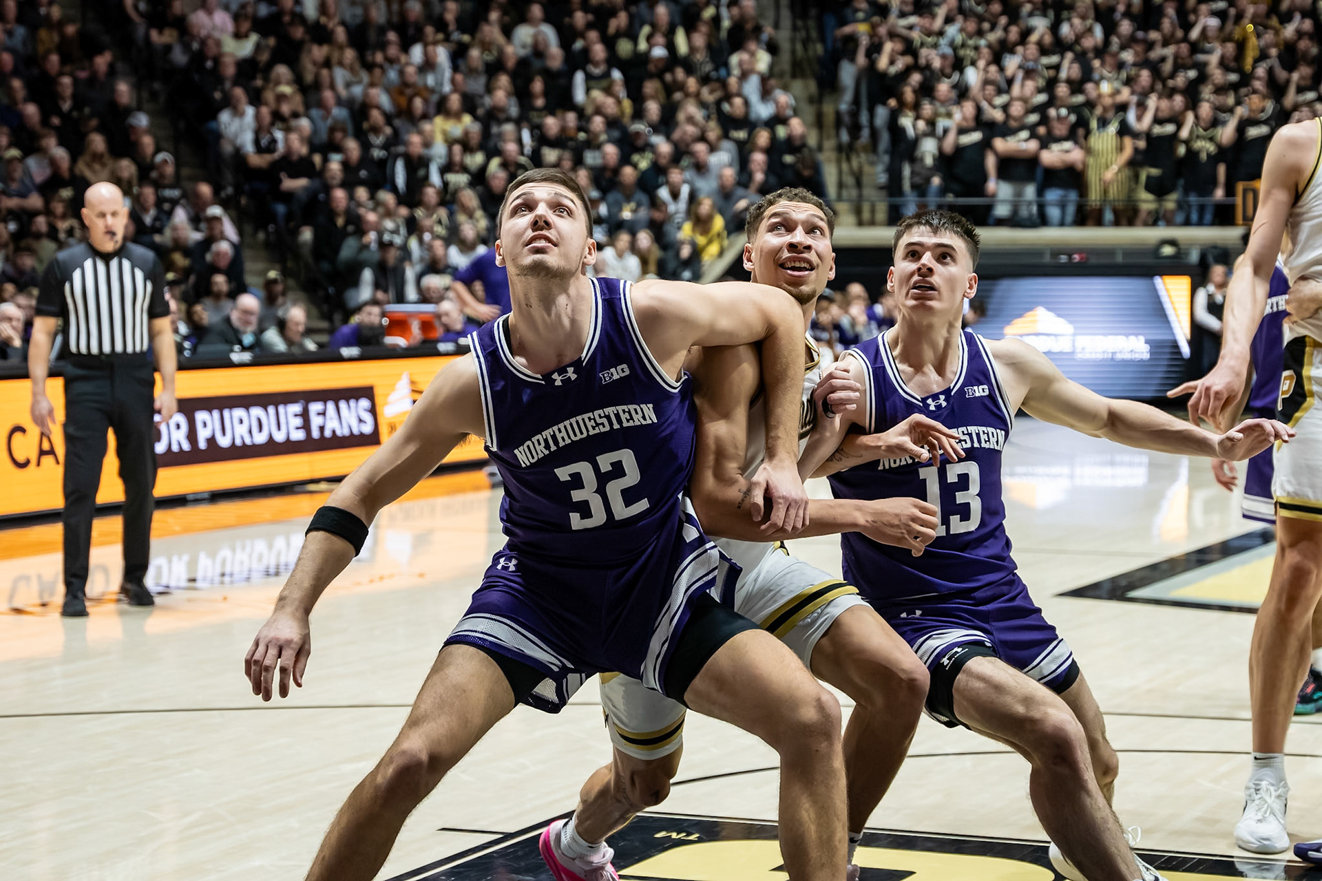 WEST LAFAYETTE, IN - JANUARY 31, 2024: Northwestern Graduate Forward Blake Preston (32), Purdue Senior Forward Mason Gillis (0), Northwestern Junior Guard Brooks Barnhizer (13) competing in Purdue Boilermakers Mens Basketball versus the Northwestern Wildcats at Mackey Arena(Photo by Steve Bowen / Bowen Arrow Photography / Northern Indiana Sports Report)