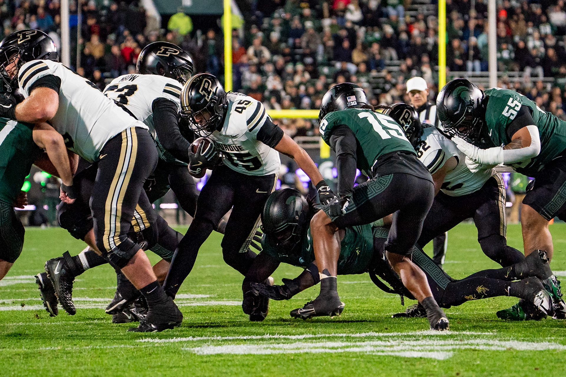 EAST LANSING, MI - NOVEMBER 22, 2024: Purdue University Junior Running Back Devin Mockobee (45) breaks through the line during the Purdue University Boilermakers at Michigan State University Spartans Football game at Spartan Stadium(Photo by Steve Bowen / Bowen Arrow Photography / Northern Indiana Sports Report)