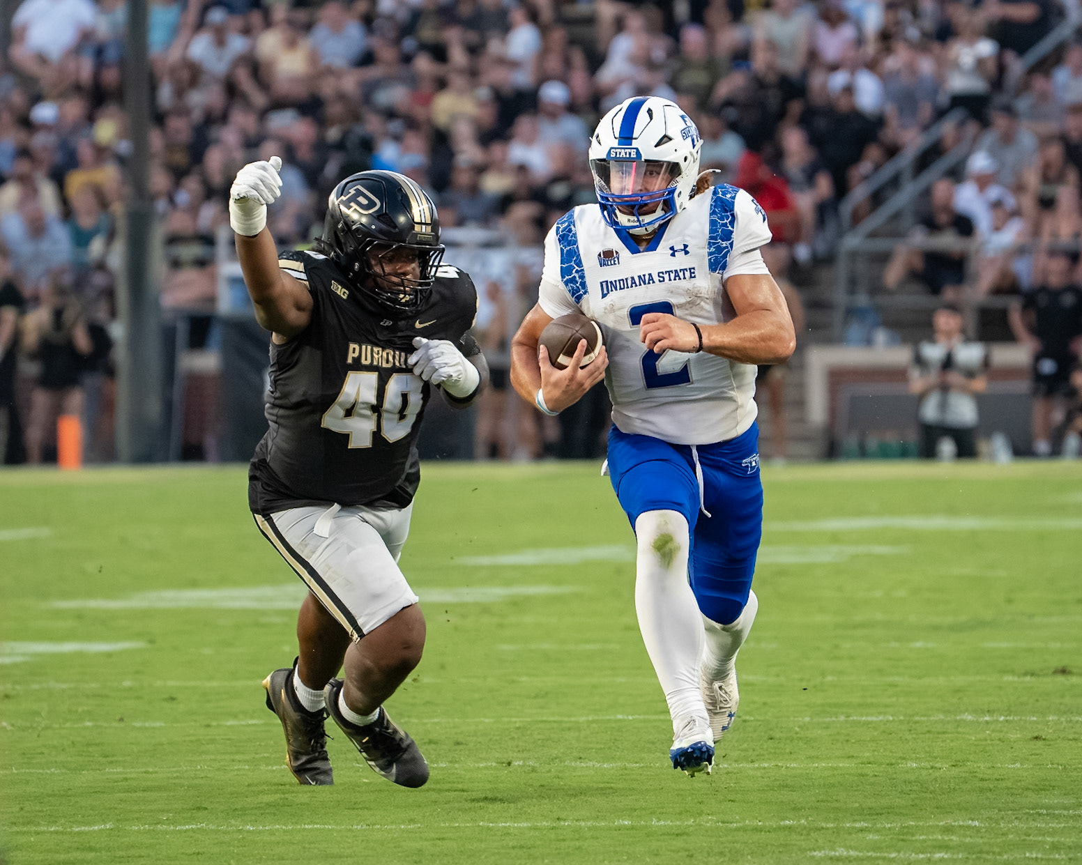 WEST LAFAYETTE, IN - SEPTEMBER 4, 2026: Purdue University Sophomore Defensive Lineman Ian Jeffries (40) tries to tackle Indiana State University Quarterback Elijah Owens (2) before he can run out of bounds during the Purdue Boilermaker Football game vs the Indiana State Sycamores at Ross-Ade Stadium(Photo by Steve Bowen / Northern Indiana Sports Report)