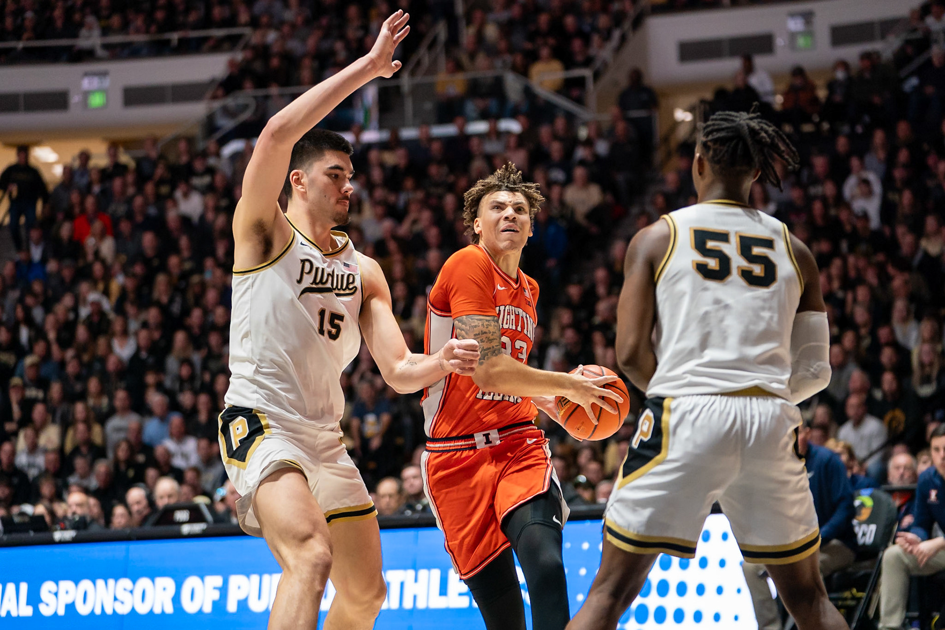 WEST LAFAYETTE, IN - JANUARY 5, 2024: Illinois Senior Forward Coleman Hawkins (33) drives the ball against Purdue Senior Center Zach Edey (15) in Purdue Boilermaker's Basketball vs the Illinois Fighting Illini at Mackey Arena(Photo by Steve Bowen / Bowen Arrow Photography / Northern Indiana Sports Report)