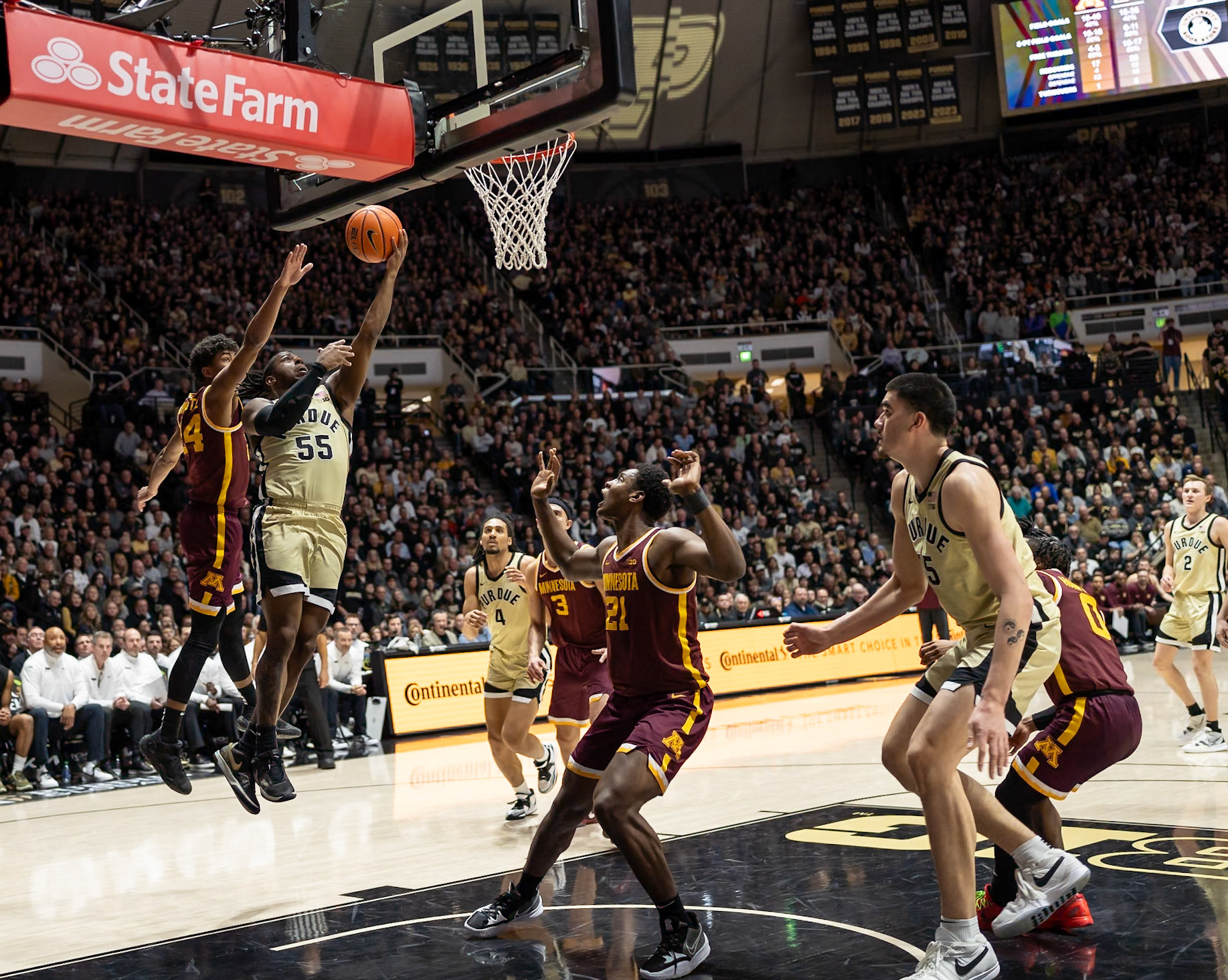 WEST LAFAYETTE, IN - FEBRUARY 15, 2024: Purdue 5th year Guard Lance Jones (55), Minnesota Freshman Guard Cam Christie (24) in Purdue Boilermakers Men's Basketball vs the Minnesota Golden Gophers at Mackey Arena(Photo by Steve Bowen / Bowen Arrow Photography / Northern Indiana Sports Report)