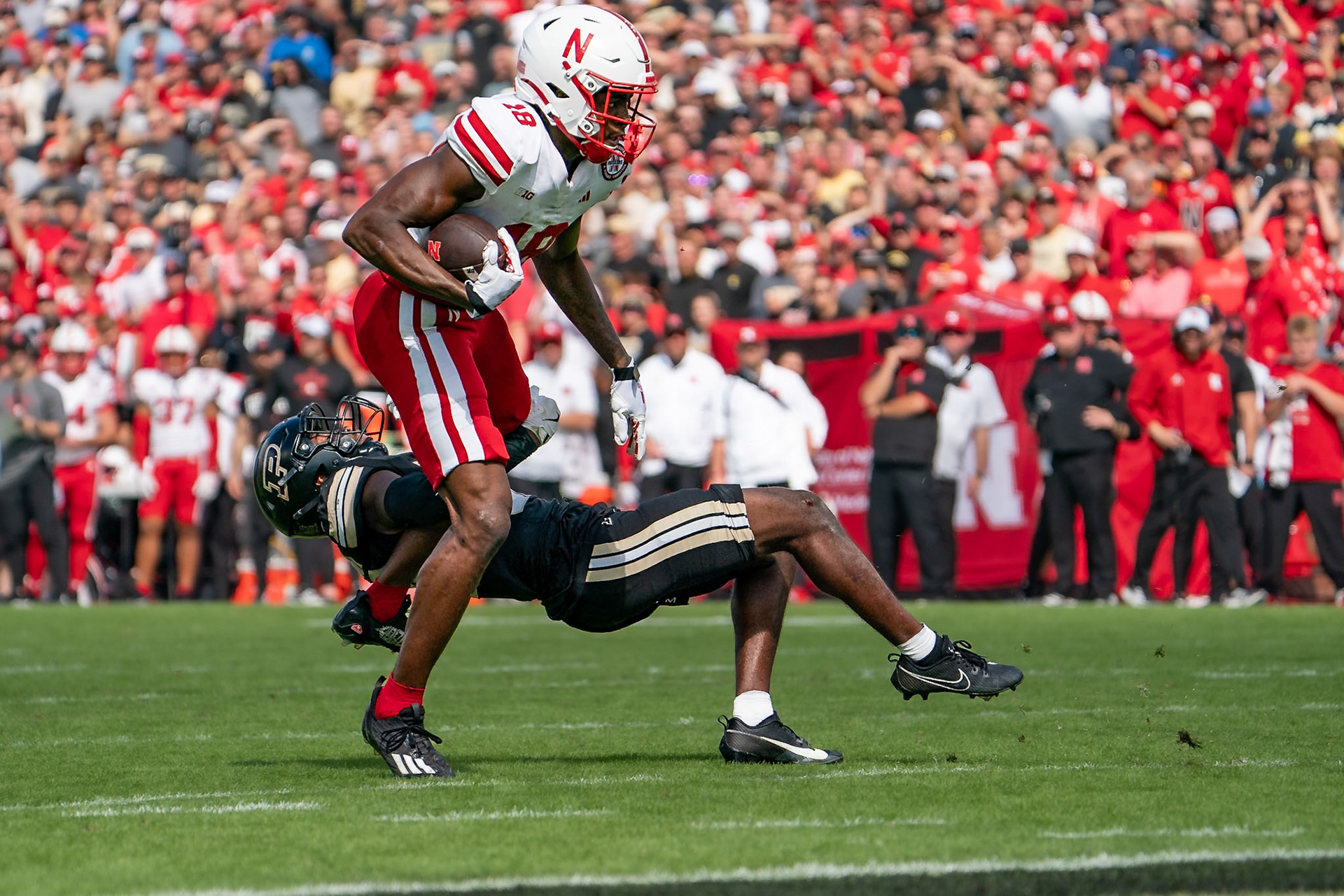 WEST LAFAYETTE, IN - SEPTEMBER 28, 2024: Nebraska University Senior Wide Receiver Isaiah Neyor (18), Purdue University Sophomore Defensive Back Joseph Jefferson II (32) during the Purdue University Boilermakers vs Nebraska University Cornhuskers Football game at Ross-Ade Stadium(Photo by Steve Bowen / Bowen Arrow Photography / Northern Indiana Sports Report)