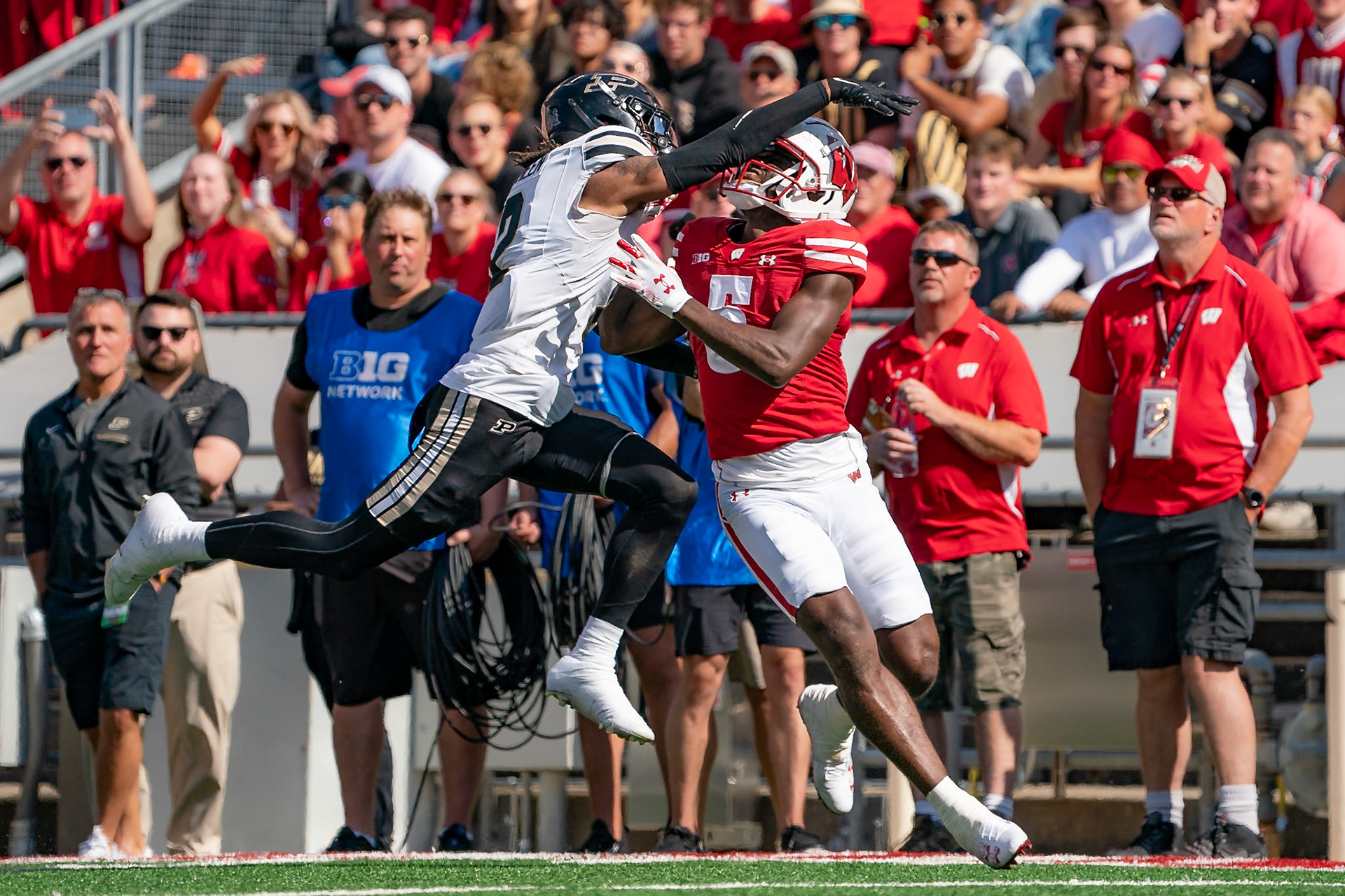 MADISON, WI - OCTOBER 5, 2024: University of Wisconsin Redshirt Sophomore WR Quincy Burroughs (5) trying to catch a deep throw while being defended by Purdue University Junior Defensive Back Nyland Green (2) during the Purdue University Boilermakers at University of Wisconsin Badger Football game at Camp Randall Stadium(Photo by Steve Bowen / NISports Report)