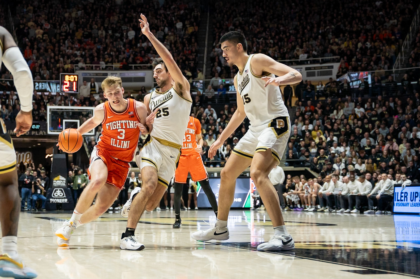 WEST LAFAYETTE, IN - JANUARY 5, 2024: Illinois Graduate Guard/Forward Marcus Domask (3) driving the ball against Purdue Senior Guard Ethan Morton (25) and Purdue Senior Center Zach Edey (15) in Purdue Boilermaker's Basketball vs the Illinois Fighting Illini at Mackey Arena(Photo by Steve Bowen / Bowen Arrow Photography / Northern Indiana Sports Report)