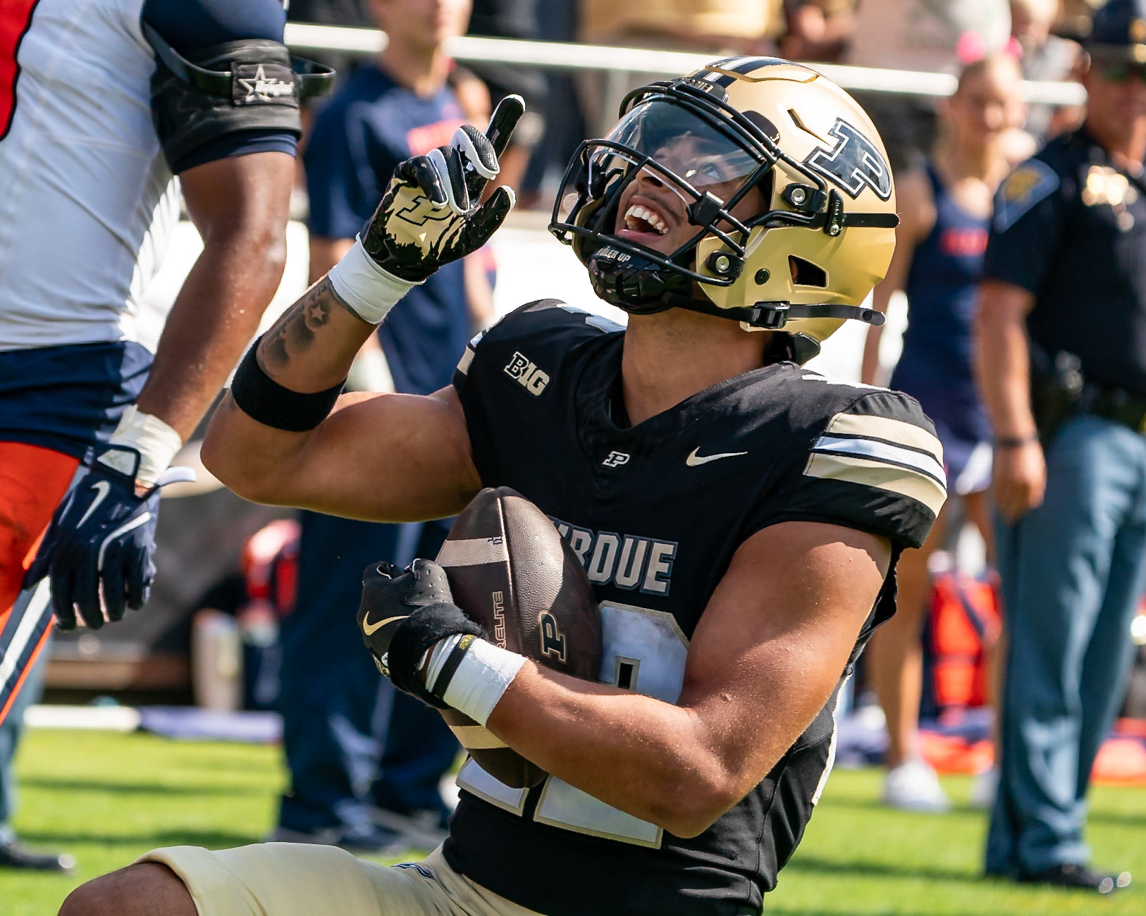 WEST LAFAYETTE, IN - OCTOBER 4, 2025: Purdue University Sophomore Running Back Antonio Harris (22) takes a knee and points to the sky after scoring a touchdown during the Purdue Boilermaker Football vs University of Illinois Fighting Illini at Ross-Ade Stadium(Photo by Steve Bowen / Northern Indiana Sports Report)