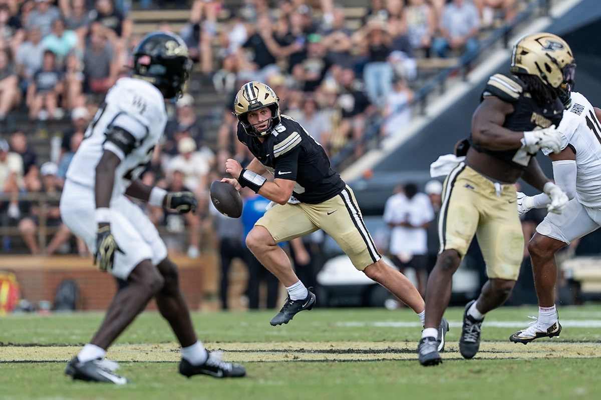 WEST LAFAYETTE, IN - SEPTEMBER 12, 2026: Purdue University Quarterback Ryan Browne (15) escapes the pocket and defensive pressure during the Purdue Boilermakers football game vs the Wake Forest Demon Deacons at Ross-Ade Stadium(Photo by Steve Bowen / Northern Indiana Sports Report)