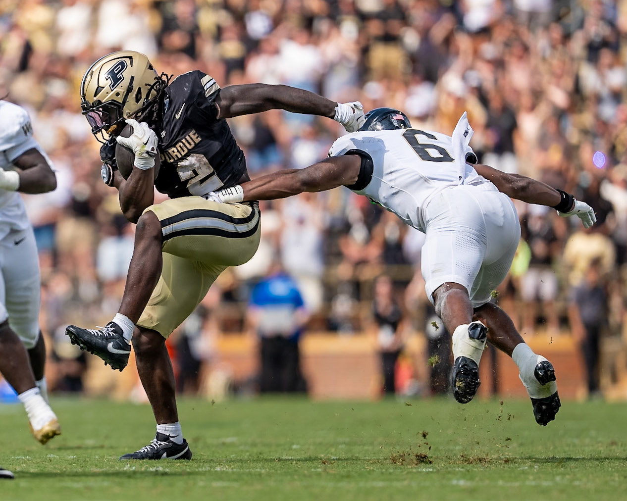 WEST LAFAYETTE, IN - SEPTEMBER 12, 2026: Purdue University Sophomore Running Back Fame Ijeboi (2) tries to shake off Wake Forest University Defensive Back Rushaun Tongue (6) during the Purdue Boilermakers football game vs the Wake Forest Demon Deacons at Ross-Ade Stadium(Photo by Steve Bowen / Northern Indiana Sports Report)