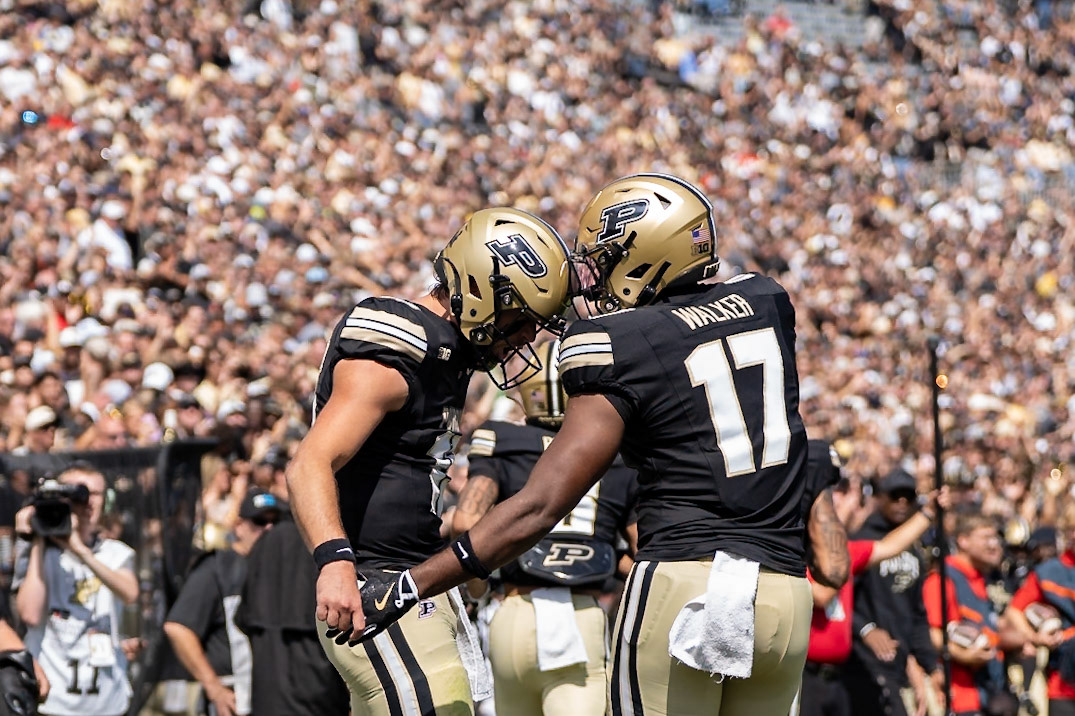 WEST LAFAYETTE, IN - AUGUST 30, 2025: Purdue University Sophomore Quaterback Ryan Browne (15) and Purdue University Junior Tight End Rico Walker (17) celebrating a touchdown at Purdue Boilermaker Football vs Ball State Football at Ross-Ade Stadium(Photo by Steve Bowen / Northern Indiana Sports Report)