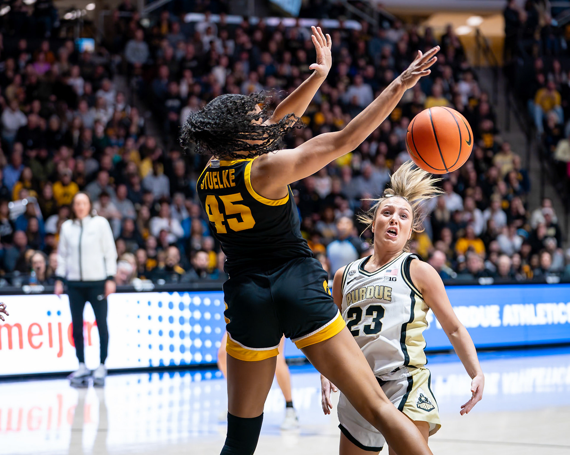 WEST LAFAYETTE, IN - JANUARY 10, 2024: Iowa Forward Sophomore Hannah Stuelke (45), Purdue 5th Year Guard Abbey Ellis (23) competing in Purdue Boilermaker Women's Basketball vs the Iowa Hawkeyes at Mackey Arena(Photo by Steve Bowen / Bowen Arrow Photography / Northern Indiana Sports Report)