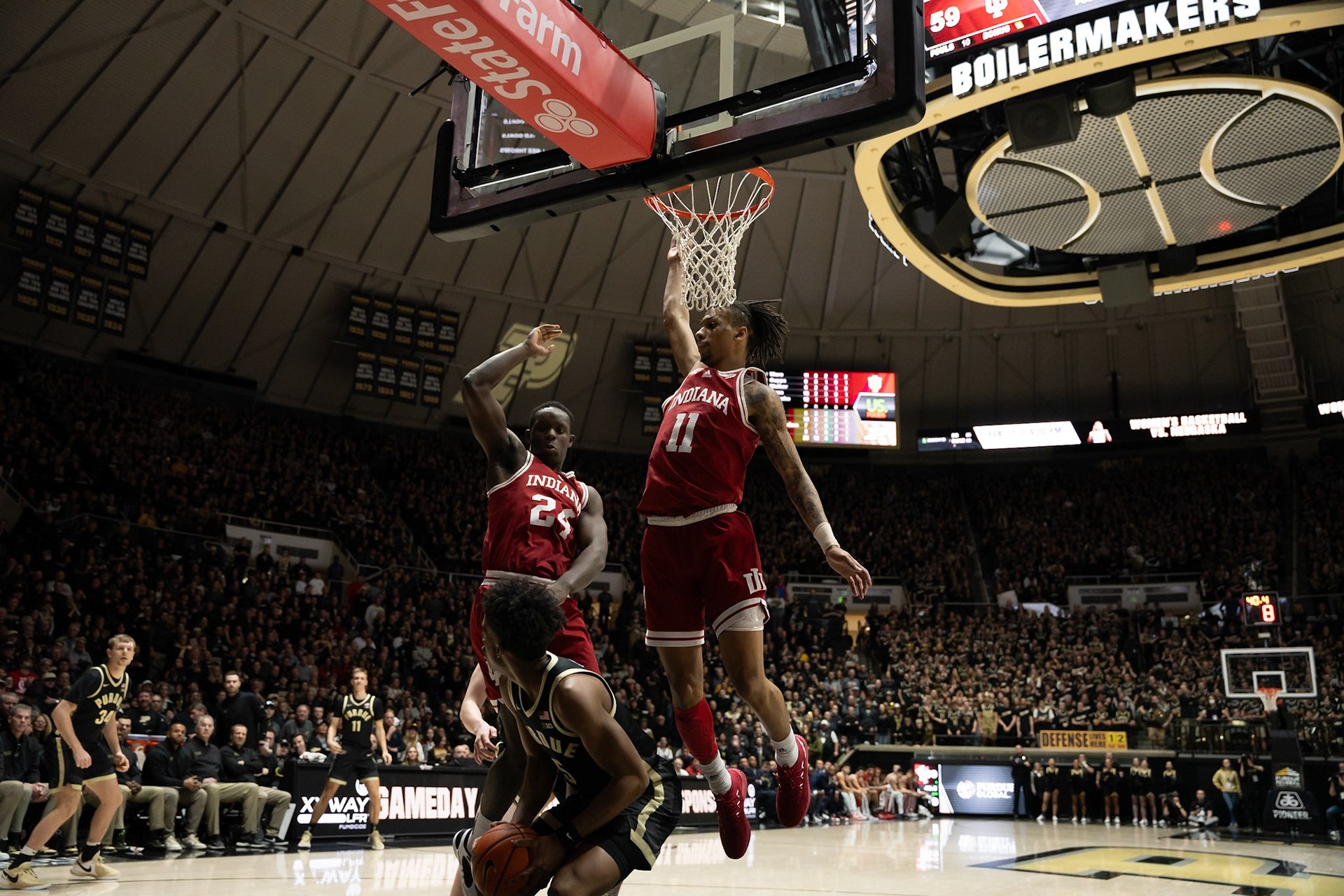 WEST LAFAYETTE, IN - FEBRUARY 10, 2024: Purdue Freshman Guard Myles Colvin (5), Indiana Sophomore Guard CJ Gunn (11), Indiana Junior Forward Payton Sparks (24) in Purdue Boilermaker vs Indiana Hoosiers Basketball at Mackey Arena(Photo by Steve Bowen / Bowen Arrow Photography / Northern Indiana Sports Report)