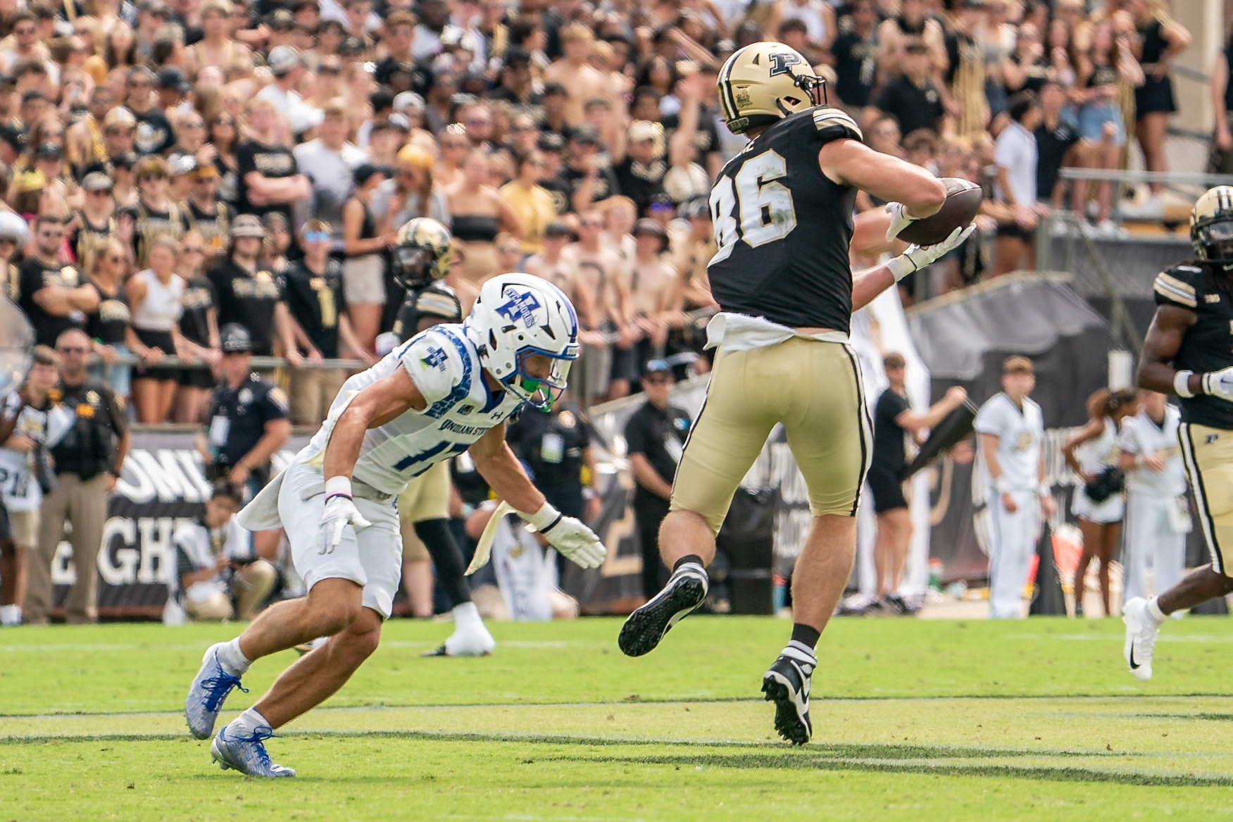 WEST LAFAYETTE, IN - AUGUST 31, 2024: Purdue So. TE Max Klare (86) making a catch as Indiana State’s R-Jr. DB Maddix Blackwell (17) comes in for the hit in the Purdue Boilermaker Football vs Indiana State Sycamores at Ross-Ade Stadium(Photo by Steve Bowen / Bowen Arrow Photography / Northern Indiana Sports Report)