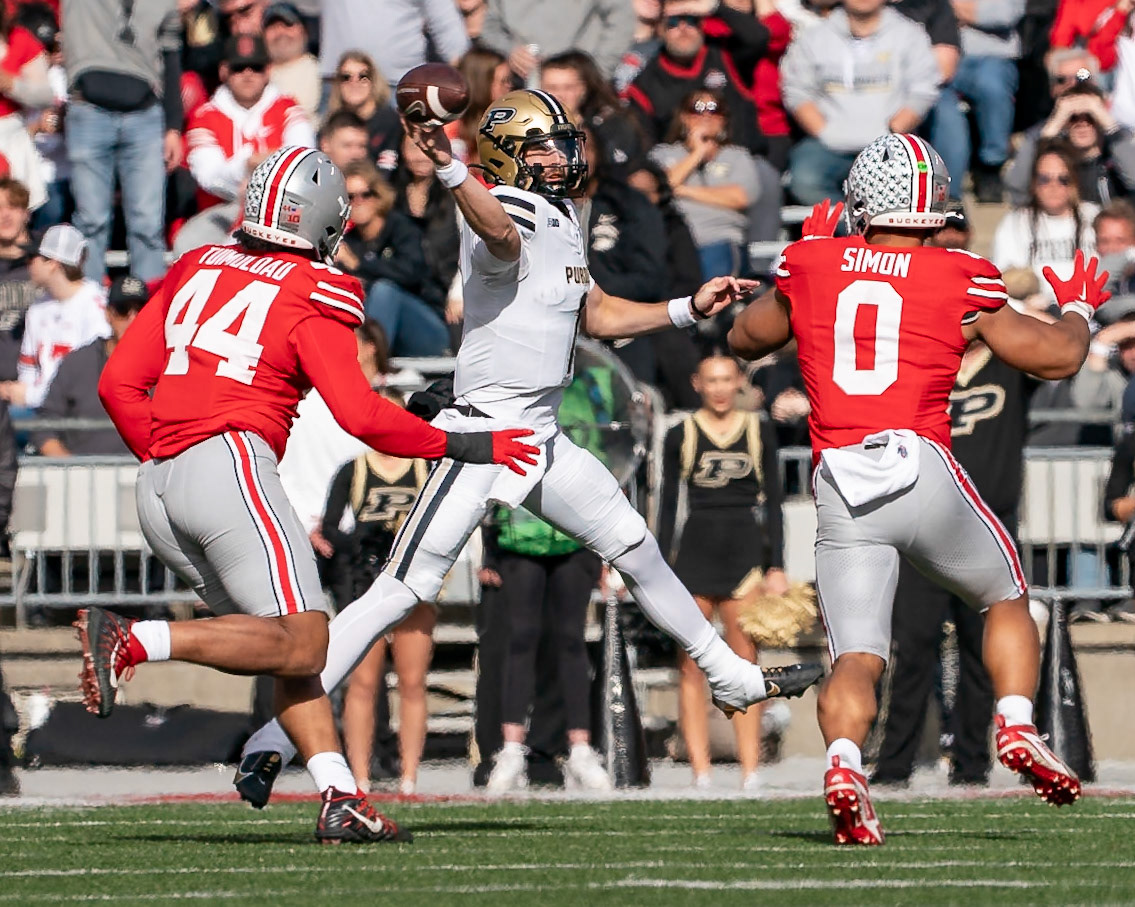 COLUMBUS UNIVERSITY, OH - NOVEMBER 9, 2024: Purdue University Senior Quaterback Hudson Card (1) passes the ball as Ohio State University Senior Defensive End JT Tuimoloau (44) and Ohio State University Graduate Linebacker Cody Simon (0) give chase in Purdue University Boilermakers at University of Ohio Buckeyes Football game at Ohio Stadium(Photo by Steve Bowen / Bowen Arrow Photography / Northern Indiana Sports Report)