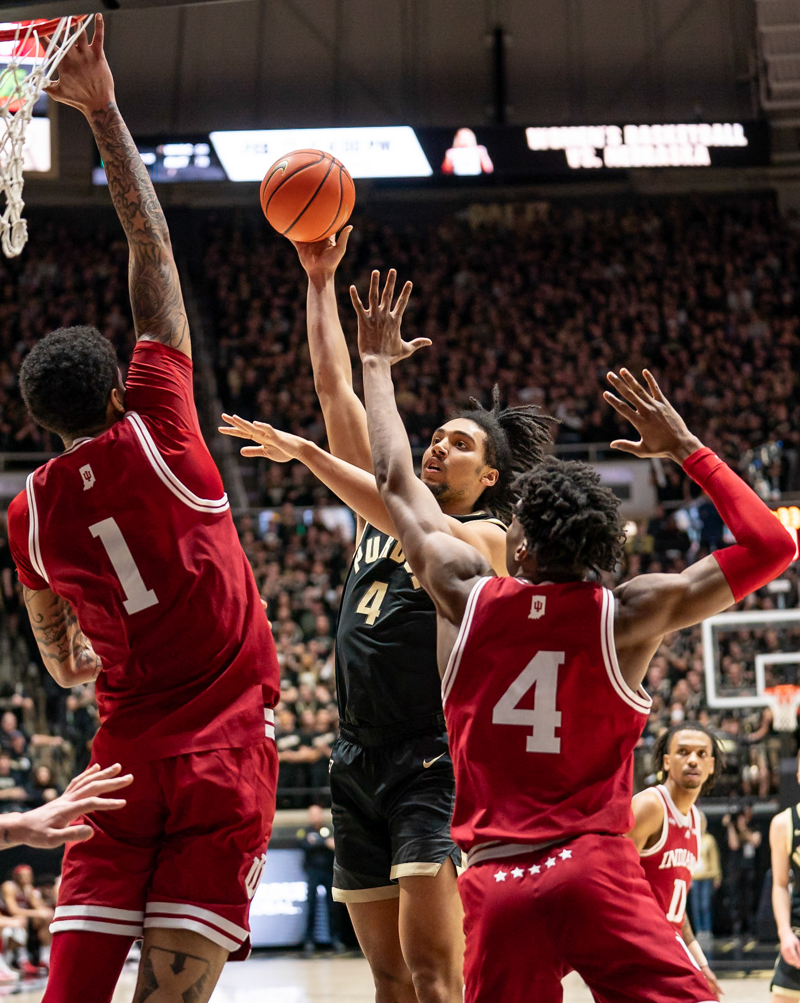 WEST LAFAYETTE, IN - FEBRUARY 10, 2024: Purdue Sophomore Forward Trey Kaufman-Renn (4), Indiana Sophomore Center Kel'el Ware (1), Indiana Fifth Year Forward Anthony Walker (4) in Purdue Boilermaker vs Indiana Hoosiers Basketball at Mackey Arena(Photo by Steve Bowen / Bowen Arrow Photography / Northern Indiana Sports Report)