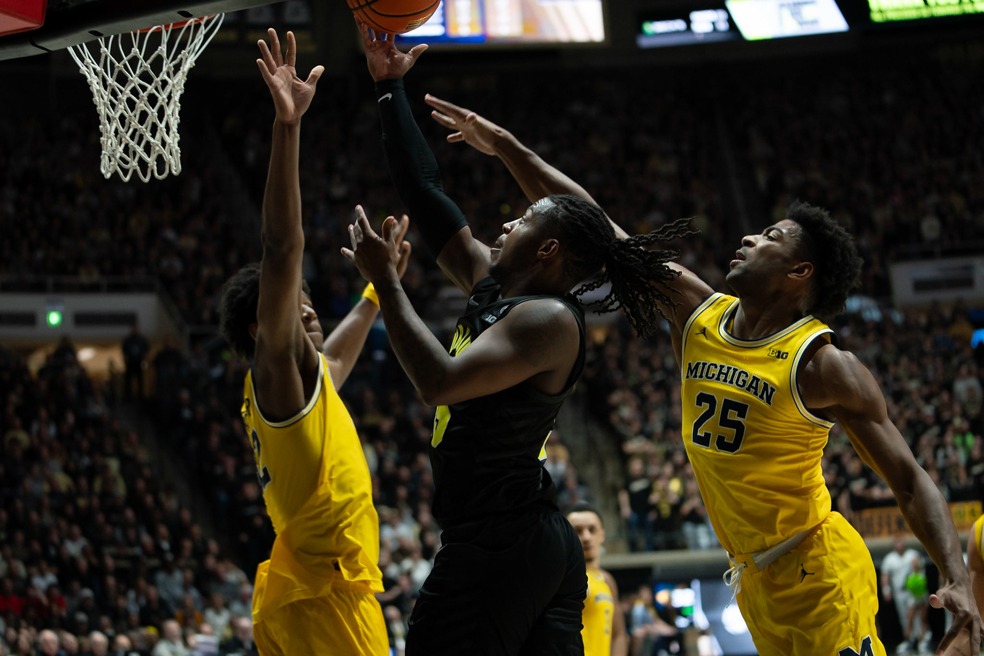 WEST LAFAYETTE, IN - JANUARY 23, 2024: Purdue 5th year Guard Lance Jones (55), Michigan Junior Guard Jace Howard (25), Michigan Sophomore Forward Tarris Reed Jr. (32) competing in Purdue versus Michigan Mens Basketball at Mackey Arena(Photo by Steve Bowen / Bowen Arrow Photography / Northern Indiana Sports Report)