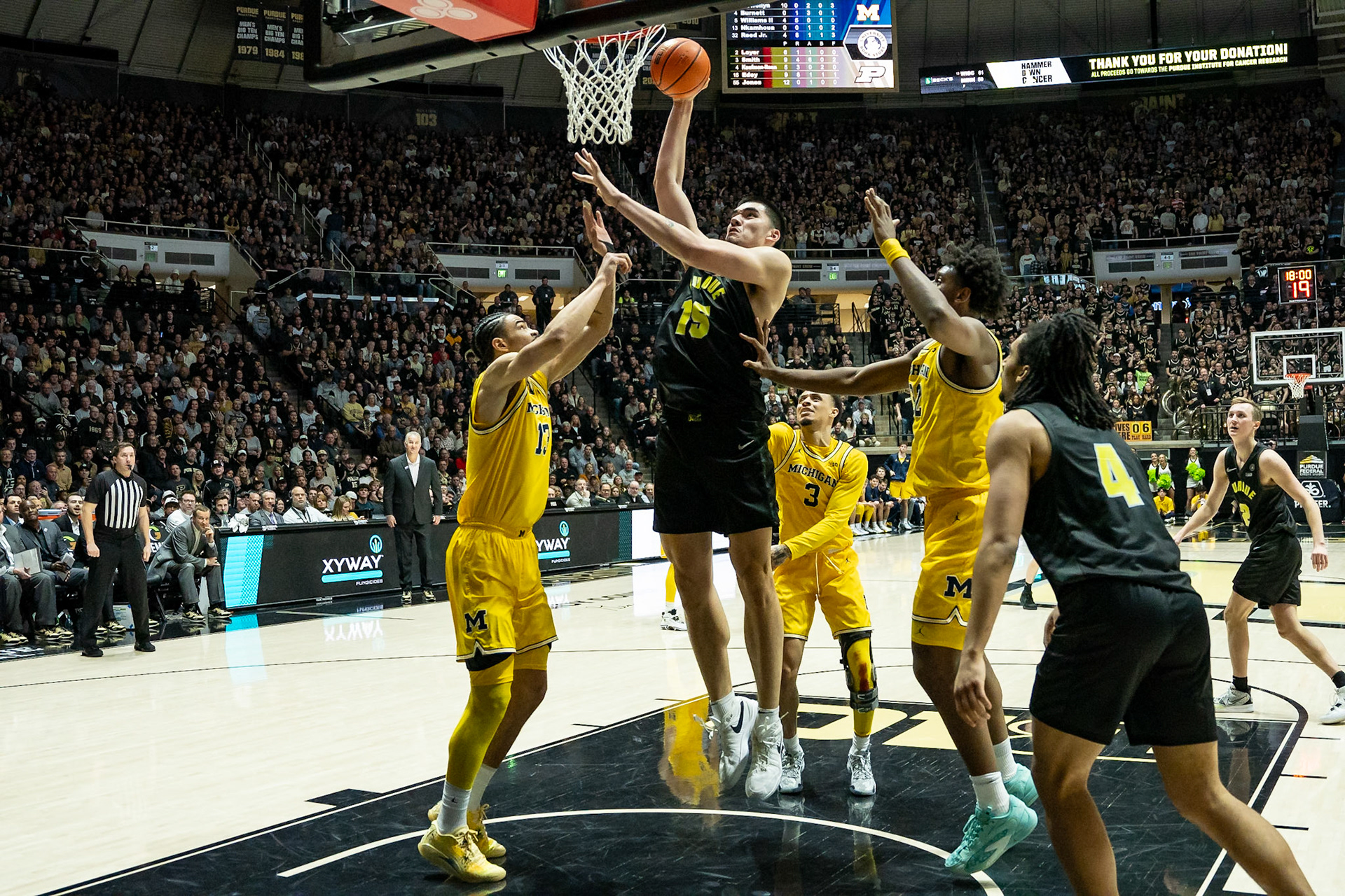 WEST LAFAYETTE, IN - JANUARY 23, 2024: Purdue Senior Center Zach Edey (15), Michigan Graduate Forward Olivier Nkamhoua (13) competing in Purdue versus Michigan Mens Basketball at Mackey Arena(Photo by Steve Bowen / Bowen Arrow Photography / Northern Indiana Sports Report)