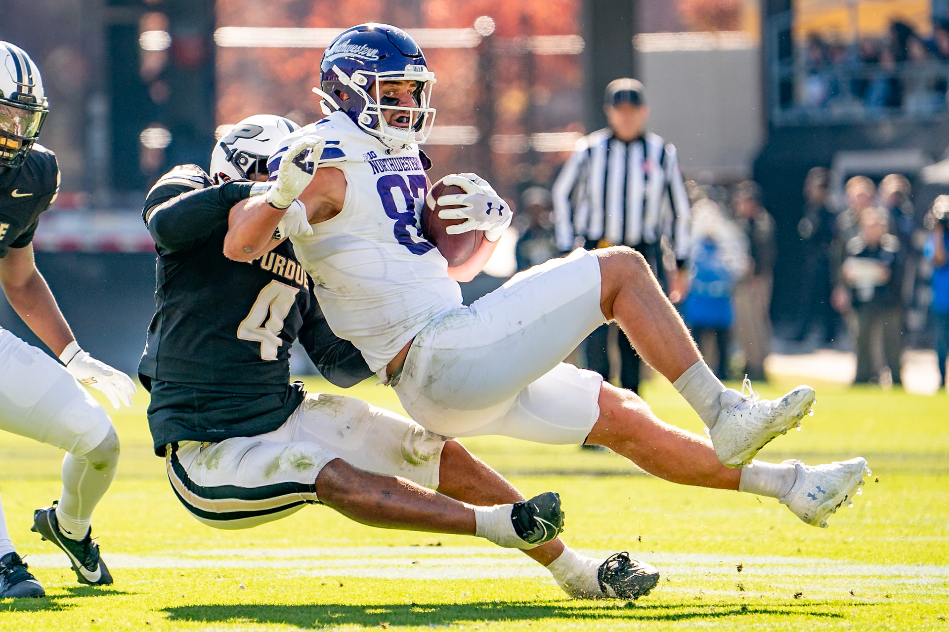 WEST LAFAYETTE, IN - NOVEMBER 2, 2024: Northwestern University Tight End Thomas Gordon (87) tackled by Purdue University Senior Linebacker Kydran Jenkins (4) during the Purdue University Boilermakers vs Northwestern University Wildcats Football game at Ross-Ade Stadium(Photo by Steve Bowen / Bowen Arrow Photography / Northern Indiana Sports Report)