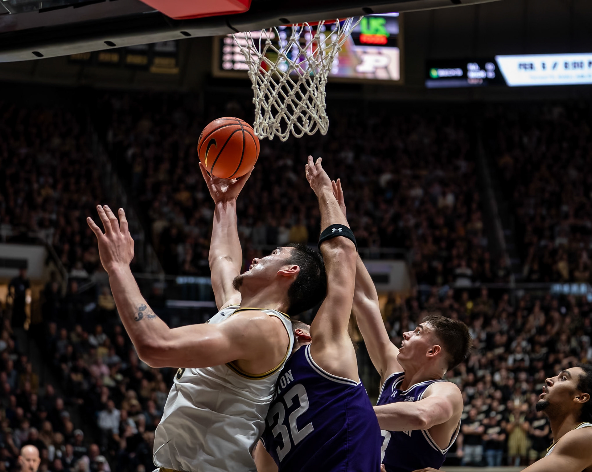 WEST LAFAYETTE, IN - JANUARY 31, 2024: Purdue Senior Center Zach Edey (15), Northwestern Graduate Forward Blake Preston (32), Northwestern Junior Guard Brooks Barnhizer (13) competing in Purdue Boilermakers Mens Basketball versus the Northwestern Wildcats at Mackey Arena(Photo by Steve Bowen / Bowen Arrow Photography / Northern Indiana Sports Report)