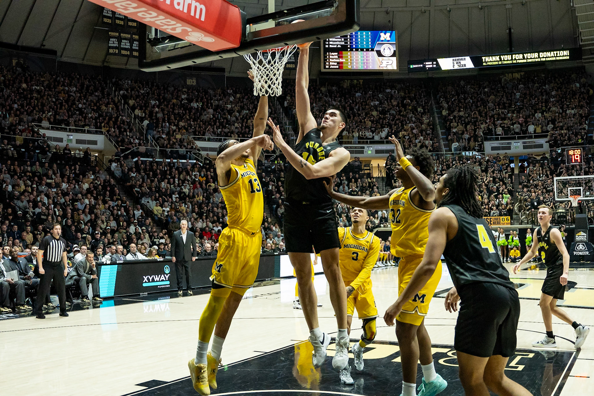 WEST LAFAYETTE, IN - JANUARY 23, 2024: Purdue Senior Center Zach Edey (15), Michigan Graduate Forward Olivier Nkamhoua (13) competing in Purdue versus Michigan Mens Basketball at Mackey Arena(Photo by Steve Bowen / Bowen Arrow Photography / Northern Indiana Sports Report)