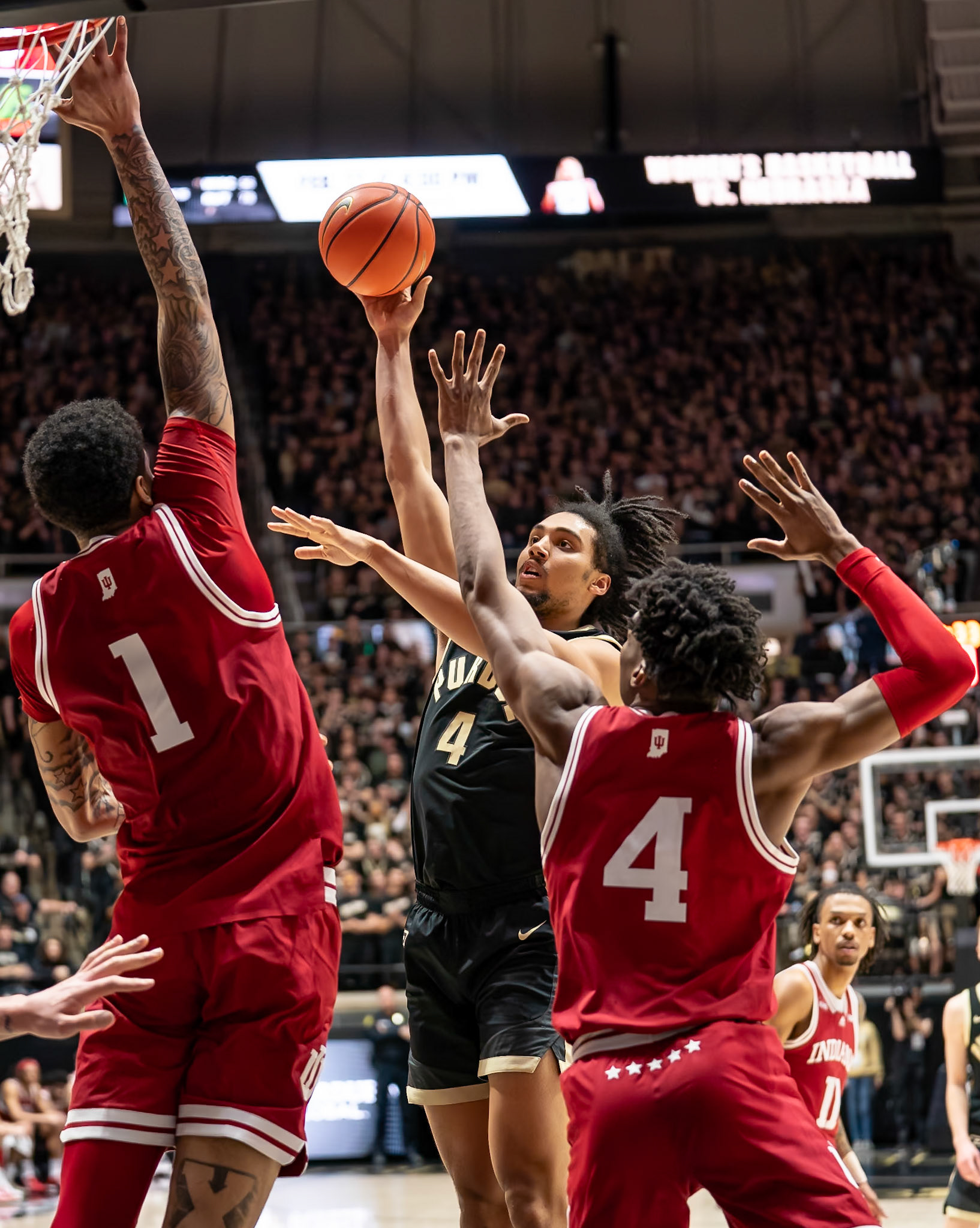 WEST LAFAYETTE, IN - FEBRUARY 10, 2024: Purdue Sophomore Forward Trey Kaufman-Renn (4), Indiana Sophomore Center Kel'el Ware (1), Indiana Fifth Year Forward Anthony Walker (4) in Purdue Boilermaker vs Indiana Hoosiers Basketball at Mackey Arena(Photo by Steve Bowen / Bowen Arrow Photography / Northern Indiana Sports Report)