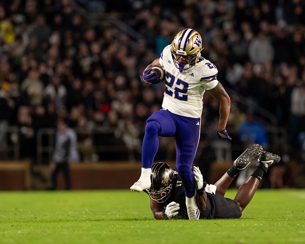 WEST LAFAYETTE, IN - OCTOBER 16, 2026: University of Washington 6th Year RB Trey Cooley (22), Purdue University Senior Defensive End Keyshawn Burgos (11) during the Purdue Boilermakers vs Washington Huskies football game at Ross-Ade Stadium(Photo by Steve Bowen / Northern Indiana Sports Report)