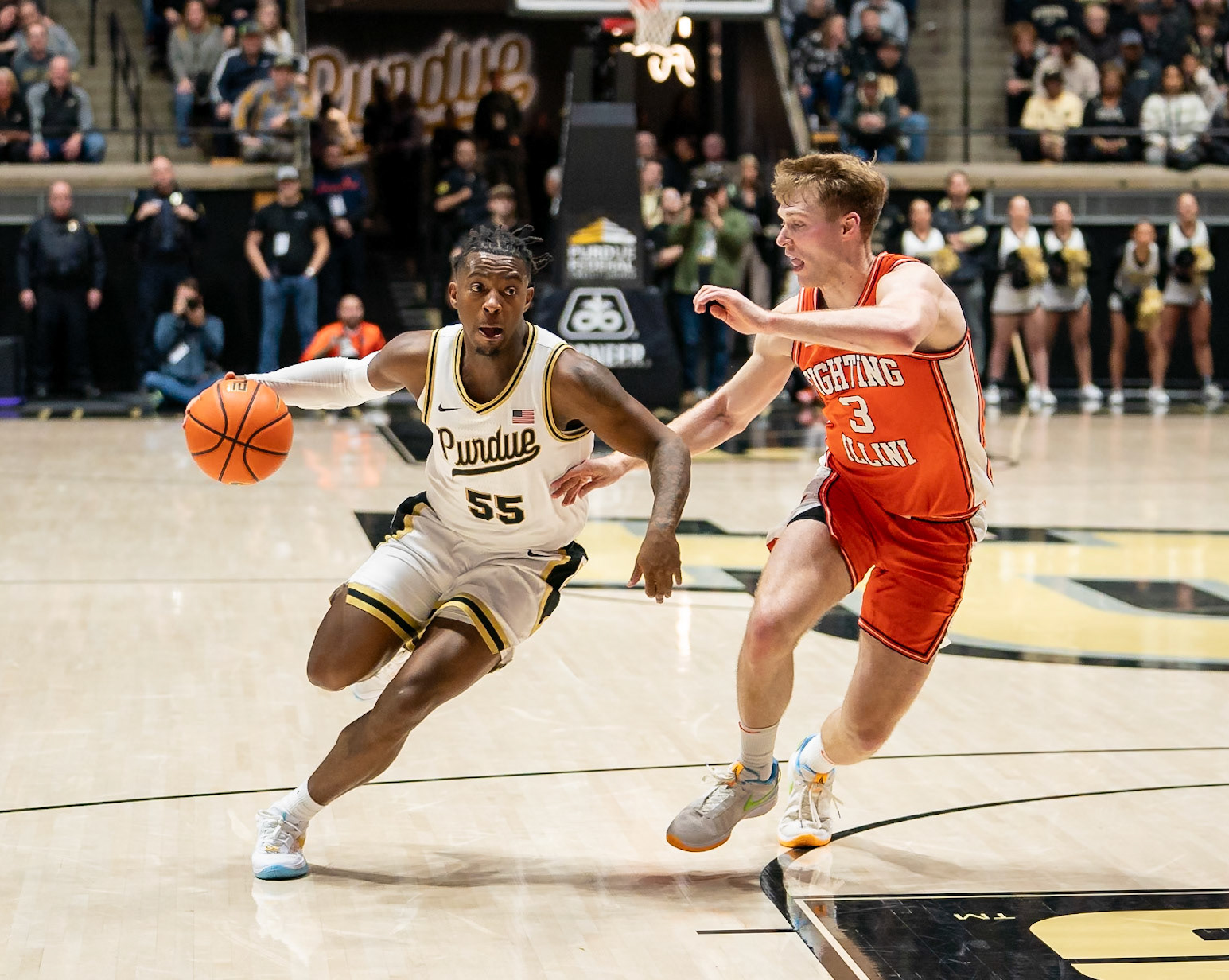 WEST LAFAYETTE, IN - JANUARY 5, 2024: Purdue 5th year Guard Lance Jones (55) driving against Illinois Graduate Guard/Forward Marcus Domask (3) in Purdue Boilermaker's Basketball vs the Illinois Fighting Illini at Mackey Arena(Photo by Steve Bowen / Bowen Arrow Photography / Northern Indiana Sports Report)