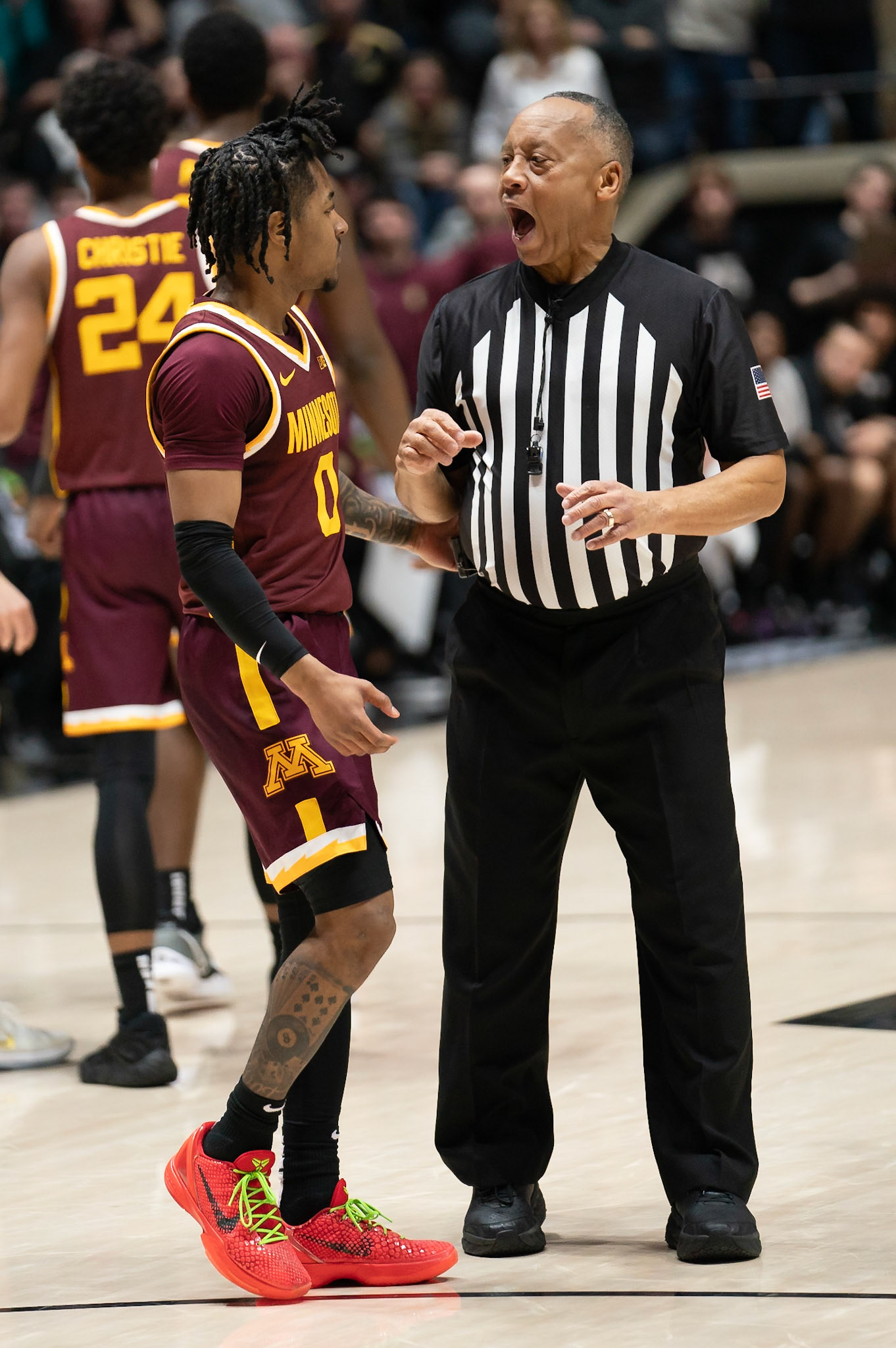 WEST LAFAYETTE, IN - FEBRUARY 15, 2024: Minnesota Junior Guard Elijah Hawkins (0), Big Ten Referee in Purdue Boilermakers Men's Basketball vs the Minnesota Golden Gophers at Mackey Arena(Photo by Steve Bowen / Bowen Arrow Photography / Northern Indiana Sports Report)
