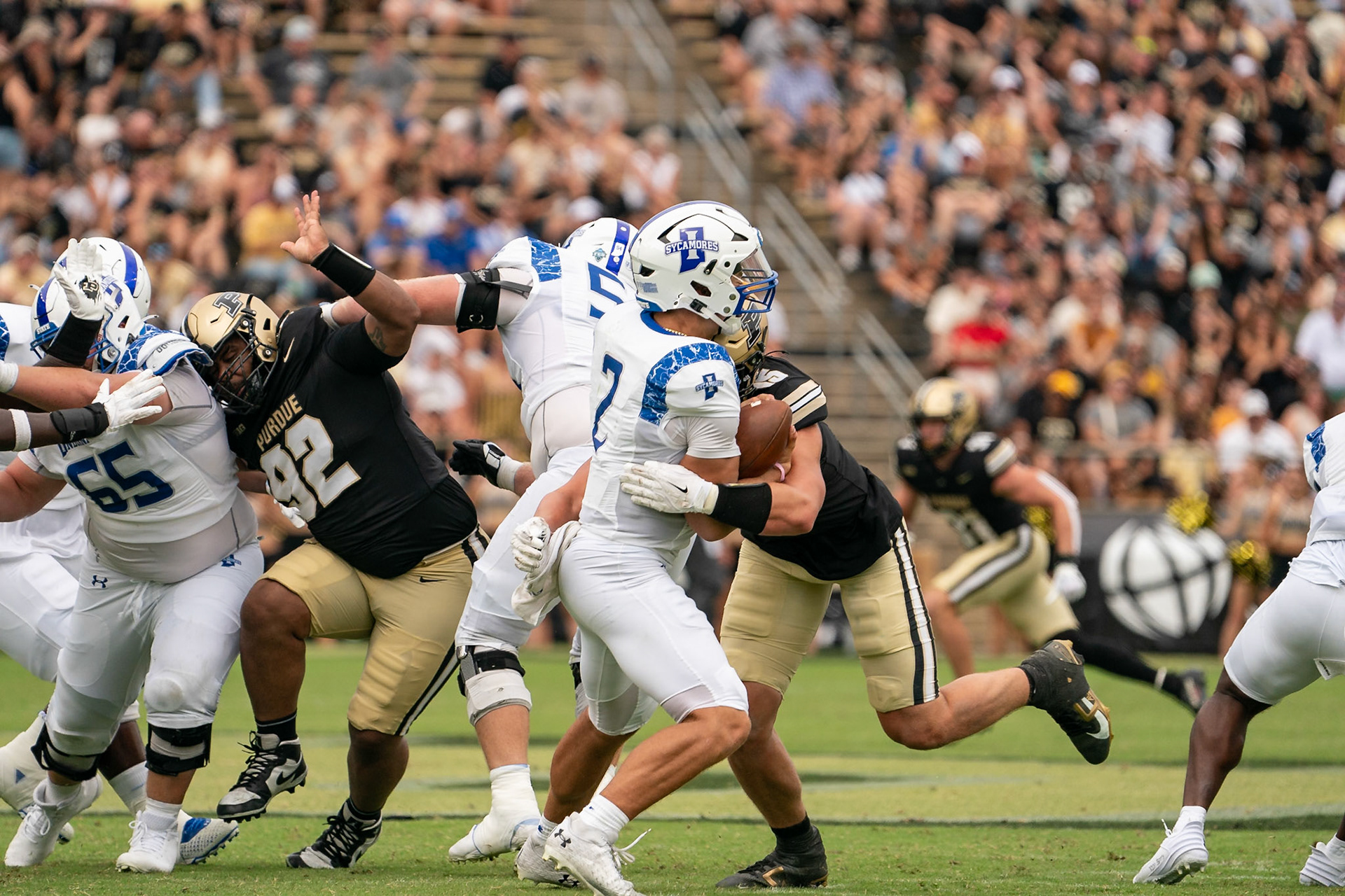 WEST LAFAYETTE, IN - AUGUST 31, 2024: Indiana State R-Fr. QB Elijah Owens (2) gets sacked by Purdue So. RUSH END Will Heldt (15) in the Purdue Boilermaker vs Indiana State Sycamores football game at Ross-Ade Stadium(Photo by Steve Bowen / Bowen Arrow Photography / Northern Indiana Sports Report)