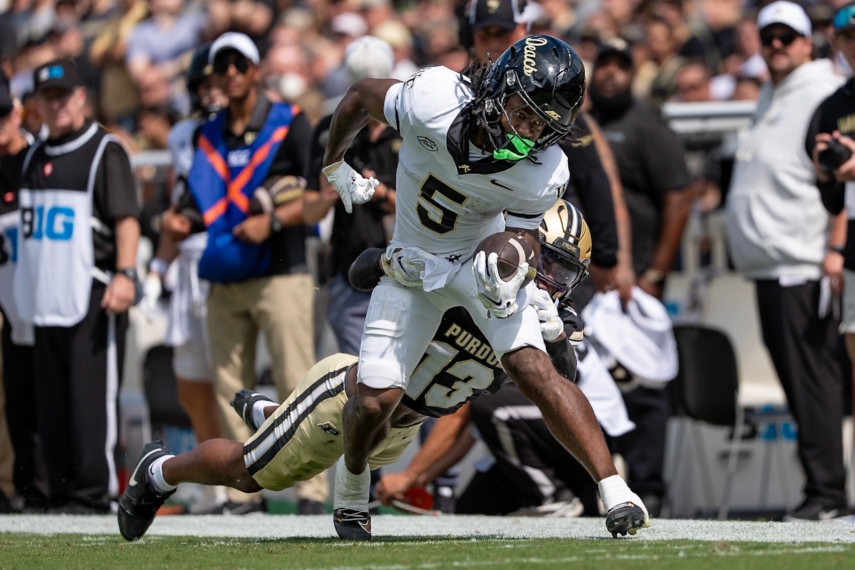 WEST LAFAYETTE, IN - SEPTEMBER 12, 2026: Purdue University Junior Defensive Back John Slaughter (13) trying too tackle Wake Forest University Wide Receiver Kam Shanks (5) during the Purdue Boilermaker Football vs the Wake Forest Demon Deacons at Ross-Ade Stadium(Photo by Steve Bowen / Northern Indiana Sports Report)