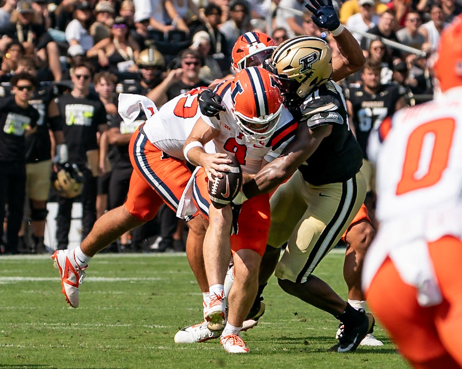 WEST LAFAYETTE, IN - OCTOBER 4, 2025: University of Illinois Senior QB Luke Altmyer (9) gets sacked by Purdue University Senior Defensive Lineman CJ Nunnally IV (91) in Purdue Boilermaker Football vs University of Illinois Fighting Illini at Ross-Ade Stadium(Photo by Steve Bowen / Northern Indiana Sports Report)