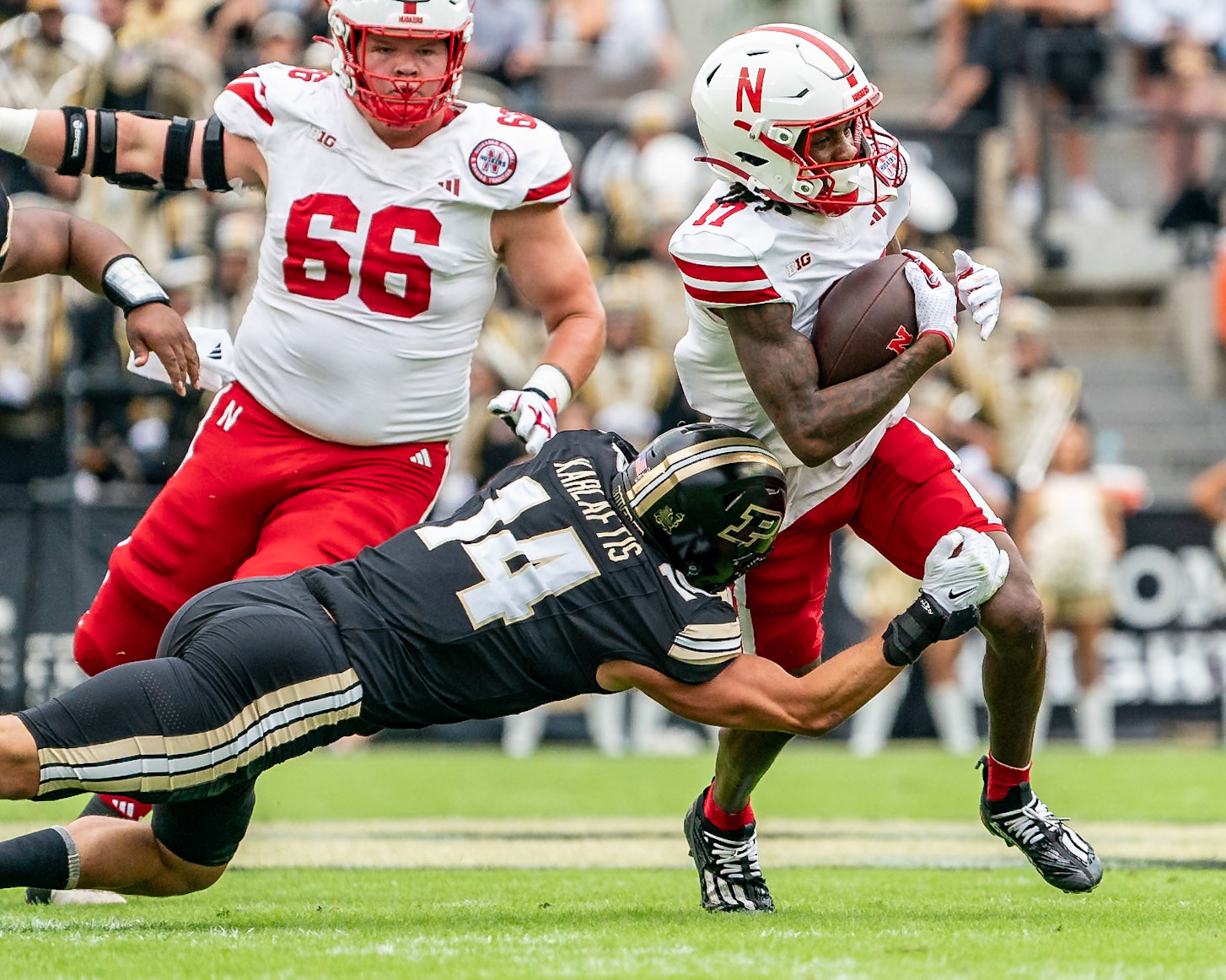 WEST LAFAYETTE, IN - SEPTEMBER 28, 2024: Nebraska University Sophomore Quarterback Luke Longval (17), Purdue University Junior Linebacker Yanni Karlaftis (14) during the Purdue University Boilermakers vs Nebraska University Cornhuskers Football game at Ross-Ade Stadium(Photo by Steve Bowen / Bowen Arrow Photography / Northern Indiana Sports Report)