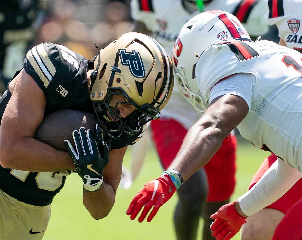 WEST LAFAYETTE, IN - AUGUST 30, 2025: Purdue University Senior Running Back Devin Mockobee (45) bracing for the hit by Ball State University R-Sr. DB Muheem McCargo (16) at Purdue Boilermaker Football vs Ball State Football at Ross-Ade Stadium(Photo by Steve Bowen / Northern Indiana Sports Report)