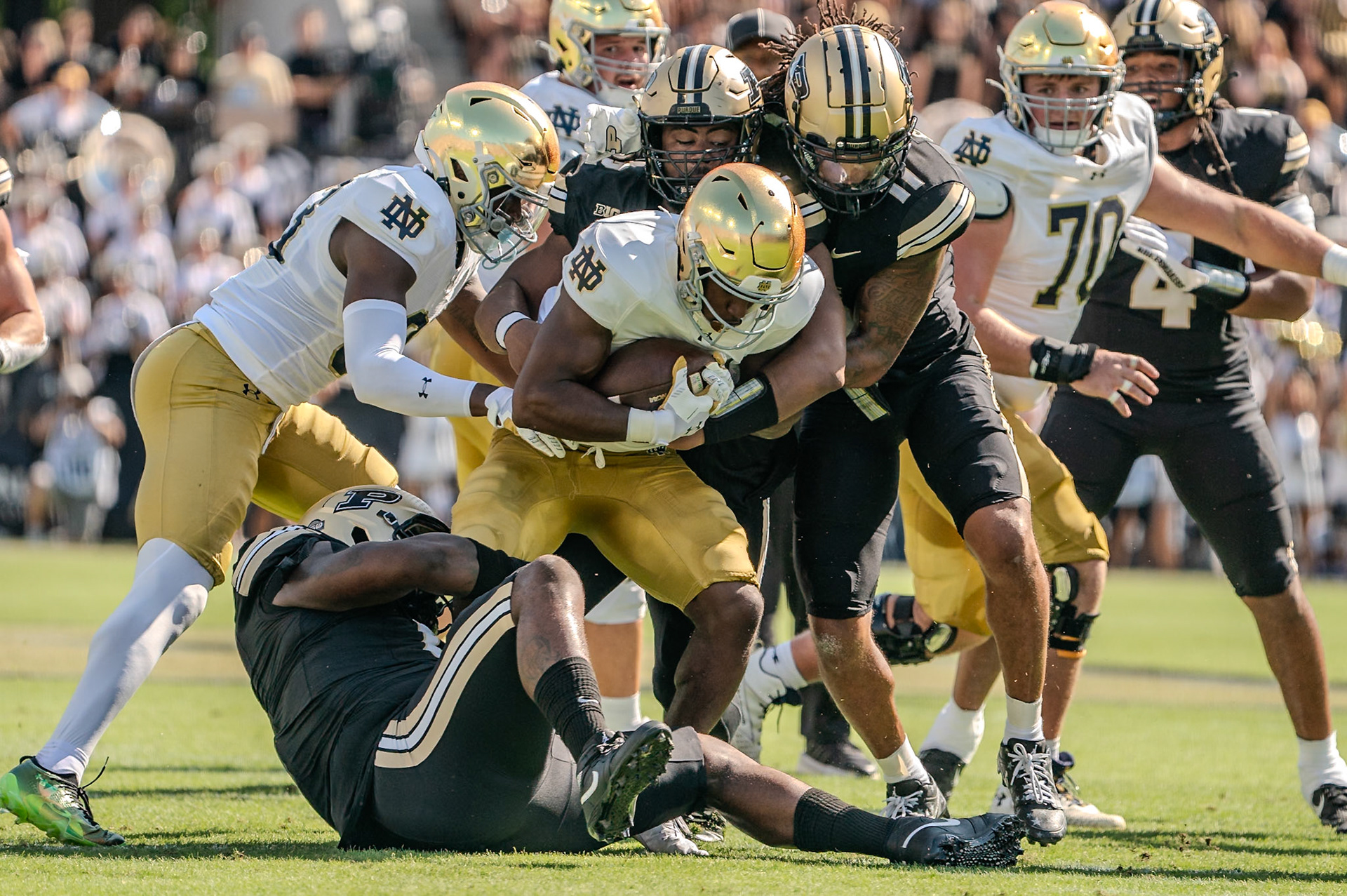 WEST LAFAYETTE, IN - SEPTEMBER 14, 2024: Notre Dame Sophomore RB Jadarian Price (24), Purdue Sr. Defensive Lineman Jeffrey M'Ba (0), Purdue Jr. Defensive Lineman Mo Omonode (92), Purdue Sr. Defensive Back Antonio Stevens (11) during the Purdue University Boilermakers vs Notre Dame Fighting Irish Football game at Ross-Ade Stadium(Photo by Steve Bowen / Bowen Arrow Photography / Northern Indiana Sports Report)