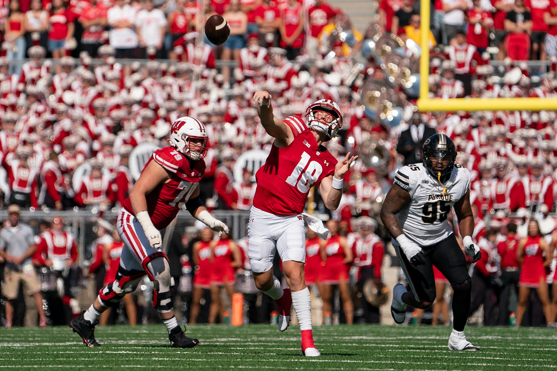 MADISON, WI - OCTOBER 5, 2024: University of Wisconsin Redshirt Sophomore QB Braedyn Locke (18) throwing a deep ball during the Purdue University Boilermakers at University of Wisconsin Badger Football game at Camp Randall Stadium(Photo by Steve Bowen / NISports Report)