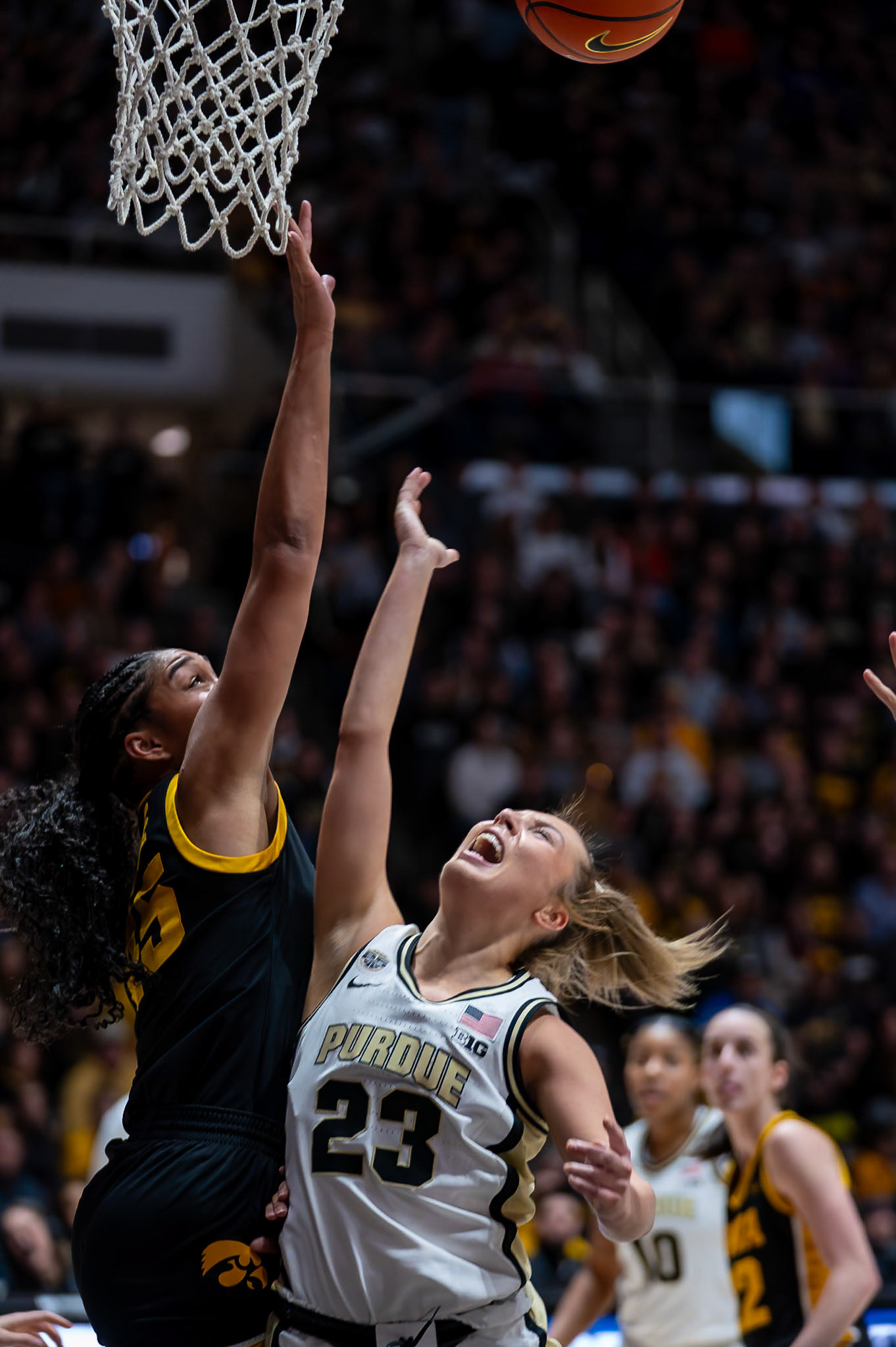 WEST LAFAYETTE, IN - JANUARY 10, 2024: Iowa Forward Sophomore Hannah Stuelke (45), Purdue 5th Year Guard Abbey Ellis (23) competing in Purdue Boilermaker Women's Basketball vs the Iowa Hawkeyes at Mackey Arena(Photo by Steve Bowen / Bowen Arrow Photography / Northern Indiana Sports Report)